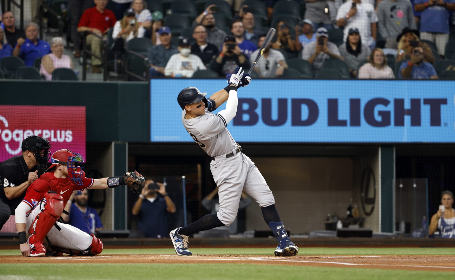 ARLINGTON, TX - OCTOBER 4: 
Aaron Judge #99 of the New York Yankees hits his 62nd home run of the season against the Texas Rangers during the first inning in game two of a double header at Globe Life Field on October 4, 2022 in Arlington, Texas. Judge has now set the American League record for home runs in a single season. (Photo by Ron Jenkins/Getty Images)