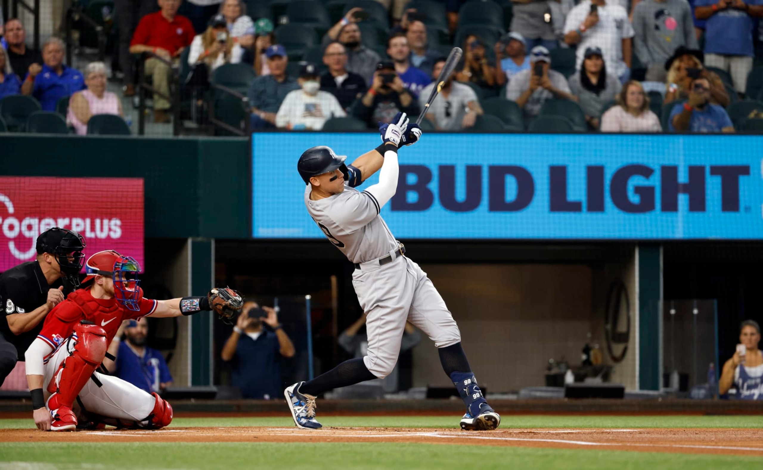 ARLINGTON, TX - OCTOBER 4: 
Aaron Judge #99 of the New York Yankees hits his 62nd home run of the season against the Texas Rangers during the first inning in game two of a double header at Globe Life Field on October 4, 2022 in Arlington, Texas. Judge has now set the American League record for home runs in a single season. (Photo by Ron Jenkins/Getty Images)