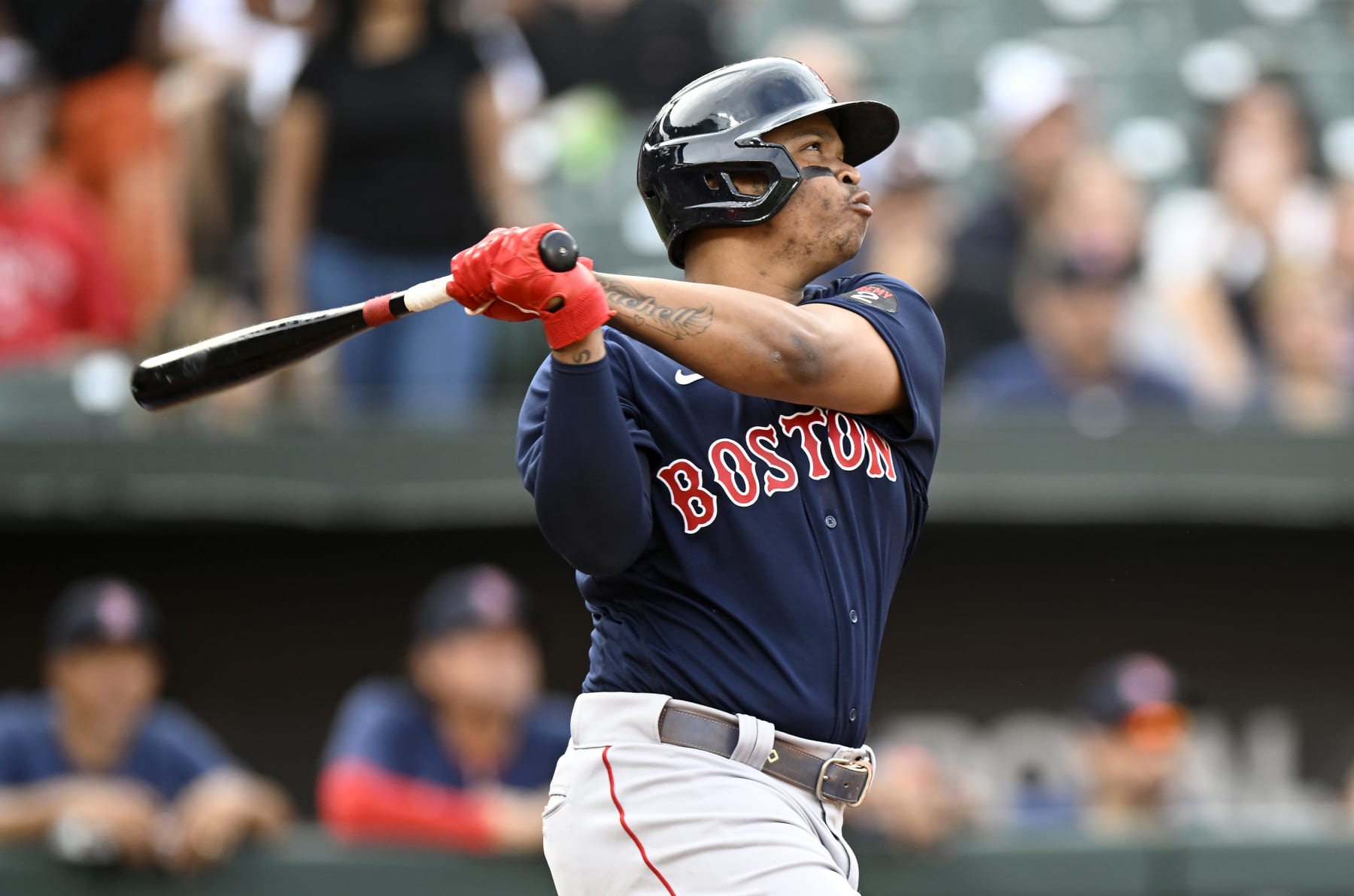 BALTIMORE, MARYLAND - SEPTEMBER 10: Rafael Devers #11 of the Boston Red Sox hits a home run against the Baltimore Orioles at Oriole Park at Camden Yards on September 10, 2022 in Baltimore, Maryland. (Photo by G Fiume/Getty Images)