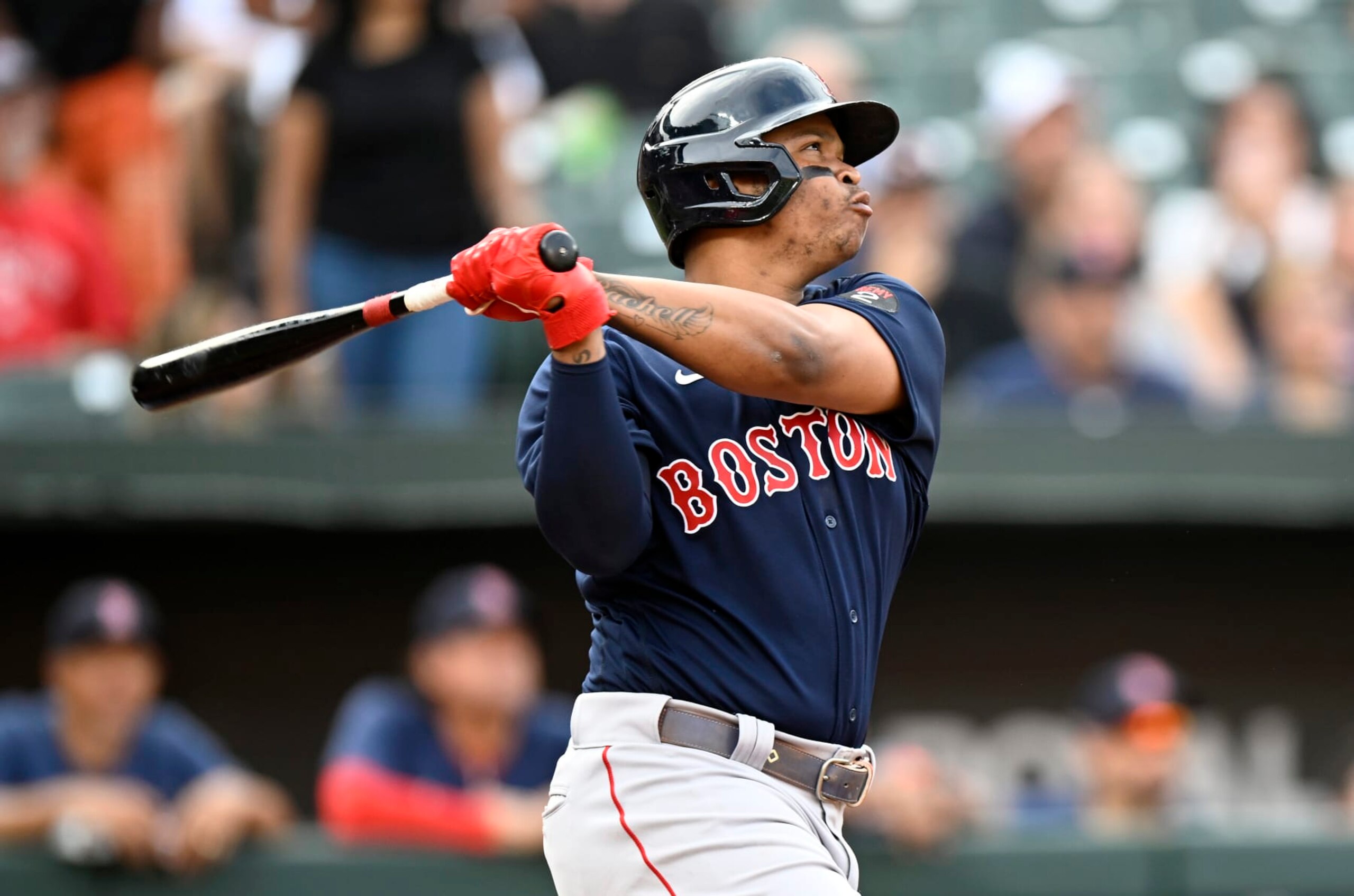 BALTIMORE, MARYLAND - SEPTEMBER 10: Rafael Devers #11 of the Boston Red Sox hits a home run against the Baltimore Orioles at Oriole Park at Camden Yards on September 10, 2022 in Baltimore, Maryland. (Photo by G Fiume/Getty Images)