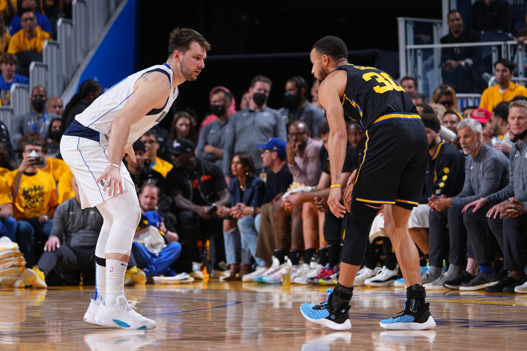 SAN FRANCISCO, CA - MAY 26: Luka Doncic #77 of the Dallas Mavericks plays defense on Stephen Curry #30 of the Golden State Warriors during Game 5 of the 2022 NBA Playoffs Western Conference Finals on May 26, 2022 at Chase Center in San Francisco, California. NOTE TO USER: User expressly acknowledges and agrees that, by downloading and or using this photograph, user is consenting to the terms and conditions of Getty Images License Agreement. Mandatory Copyright Notice: Copyright 2022 NBAE (Photo by Garrett Ellwood/NBAE via Getty Images)