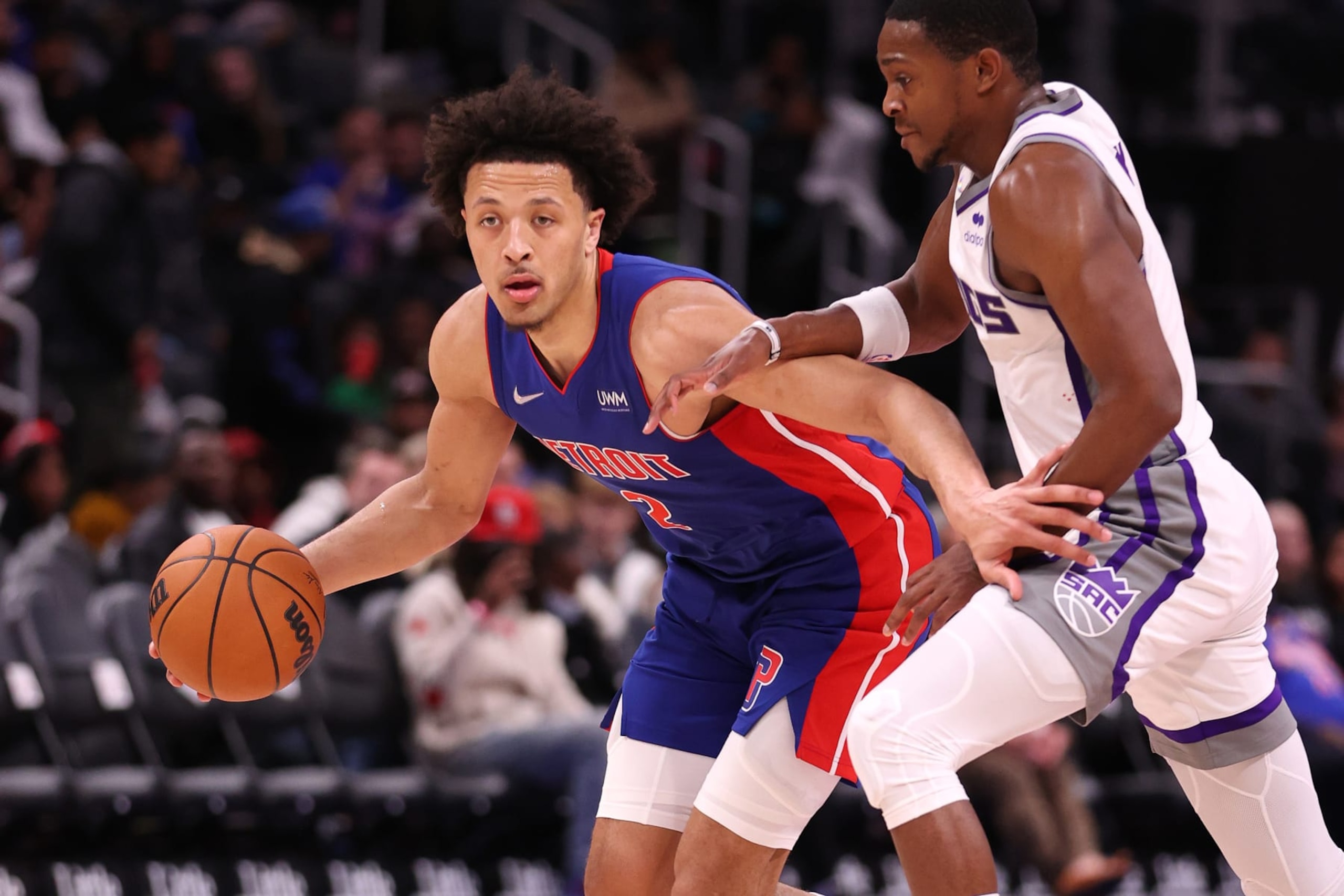 DETROIT, MICHIGAN - NOVEMBER 15: Cade Cunningham #2 of the Detroit Pistons tries to drive around De'Aaron Fox #5 of the Sacramento Kings during the second half at Little Caesars Arena on November 15, 2021 in Detroit, Michigan. Sacramento won the game 129-107. NOTE TO USER: User expressly acknowledges and agrees that, by downloading and or using this photograph, User is consenting to the terms and conditions of the Getty Images License Agreement. (Photo by Gregory Shamus/Getty Images) DETROIT, MICHIGAN - NOVEMBER 15: Cade Cunningham #2 of the Detroit Pistons tries to drive around De'Aaron Fox #5 of the Sacramento Kings during the second half at Little Caesars Arena on November 15, 2021 in Detroit, Michigan. Sacramento won the game 129-107. NOTE TO USER: User expressly acknowledges and agrees that, by downloading and or using this photograph, User is consenting to the terms and conditions of the Getty Images License Agreement. (Photo by Gregory Shamus/Getty Images)
