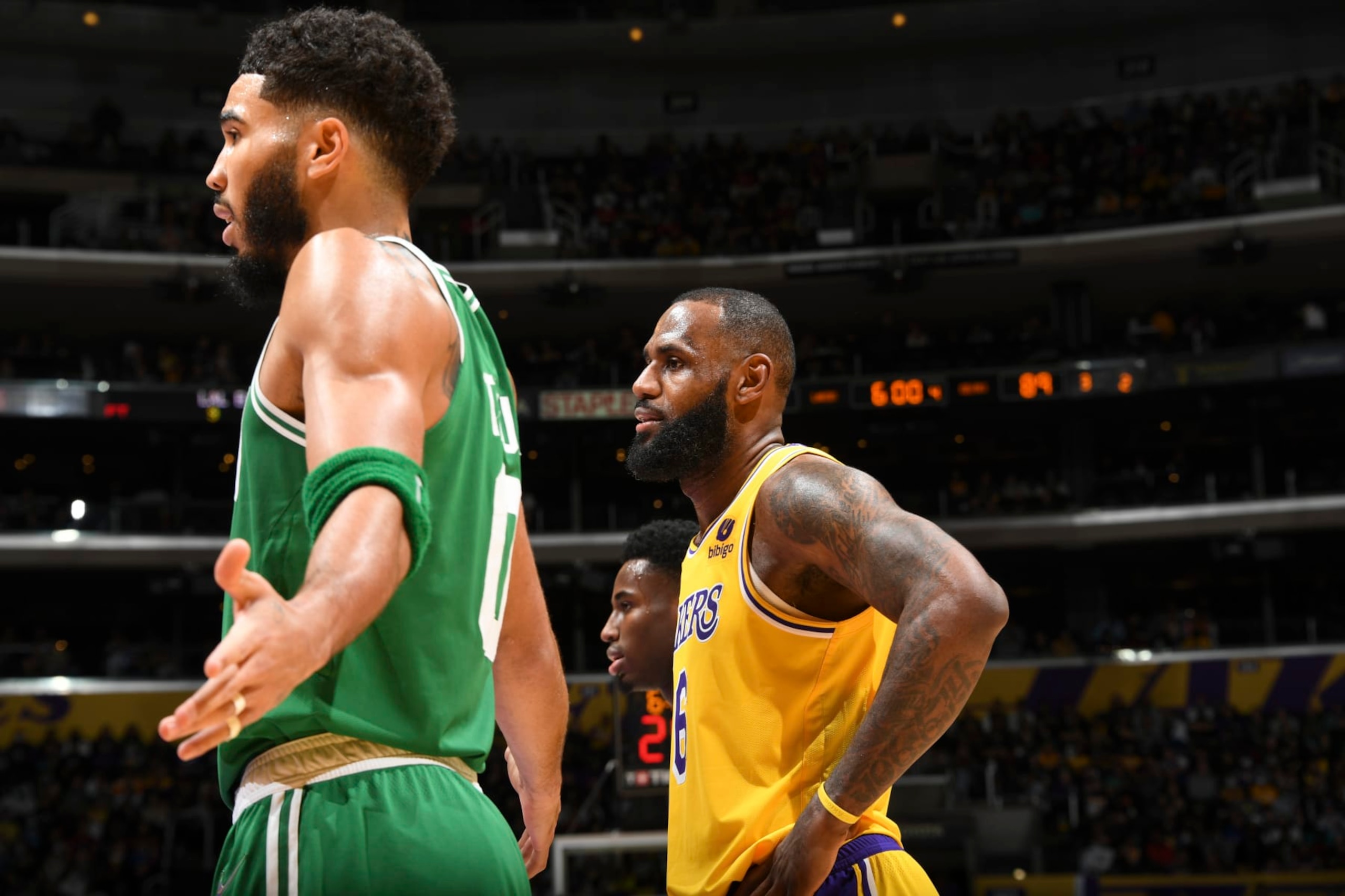 LOS ANGELES, CA - DECEMBER 7: Jayson Tatum #0 of the Boston Celtics and LeBron James #6 of the Los Angeles Lakers look on during the game on December 7, 2021 at STAPLES Center in Los Angeles, California. NOTE TO USER: User expressly acknowledges and agrees that, by downloading and/or using this Photograph, user is consenting to the terms and conditions of the Getty Images License Agreement. Mandatory Copyright Notice: Copyright 2021 NBAE (Photo by Andrew D. Bernstein/NBAE via Getty Images)