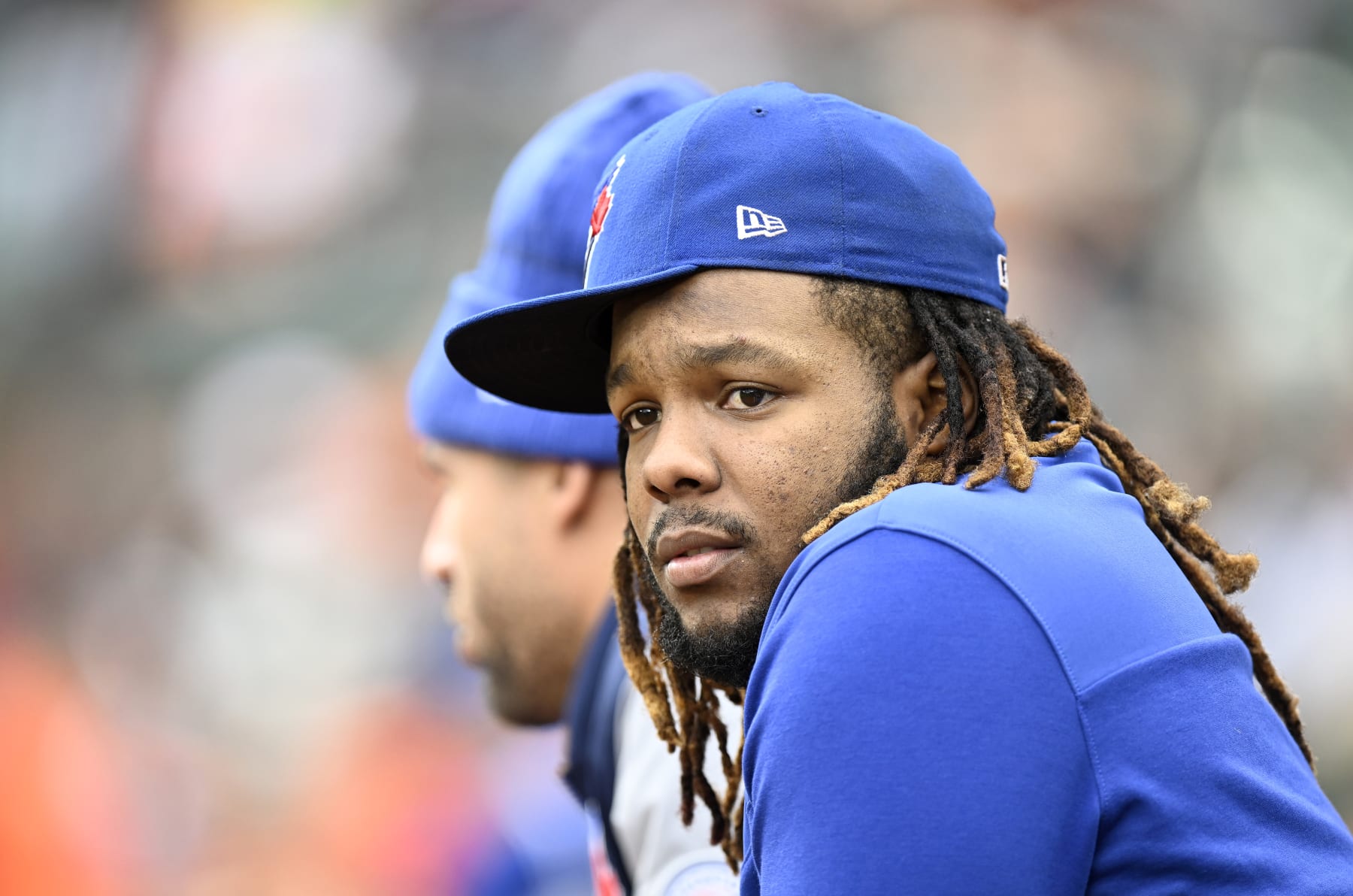 BALTIMORE, MARYLAND - OCTOBER 05: Vladimir Guerrero Jr. #27 of the Toronto Blue Jays watches the game in the second inning against the Baltimore Orioles during game two of a doubleheader at Oriole Park at Camden Yards on October 05, 2022 in Baltimore, Maryland. (Photo by Greg Fiume/Getty Images)