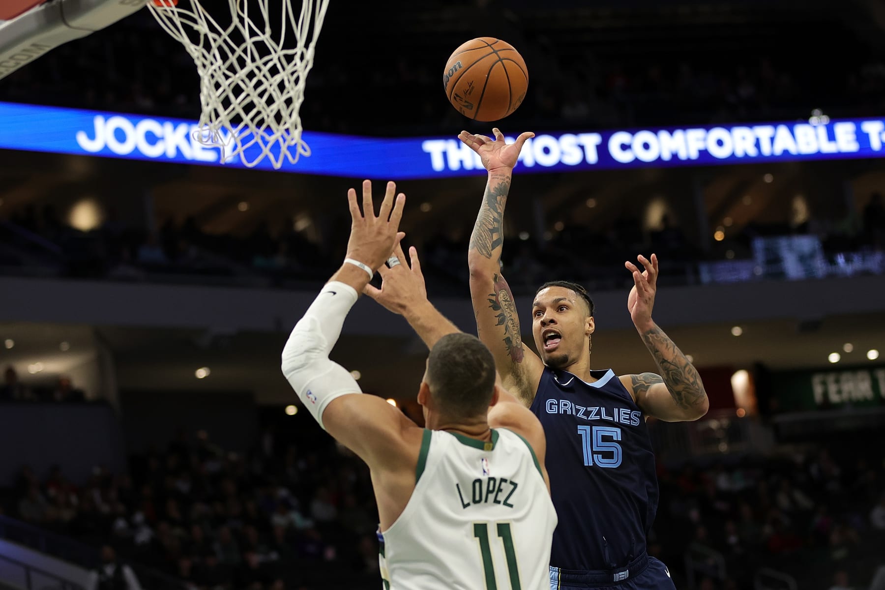 MILWAUKEE, WISCONSIN - OCTOBER 01: Brandon Clarke #15 of the Memphis Grizzlies is defended by Brook Lopez #11 of the Milwaukee Bucks during the first half of a preseason game at Fiserv Forum on October 01, 2022 in Milwaukee, Wisconsin. NOTE TO USER: User expressly acknowledges and agrees that, by downloading and or using this photograph, User is consenting to the terms and conditions of the Getty Images License Agreement. (Photo by Stacy Revere/Getty Images)
