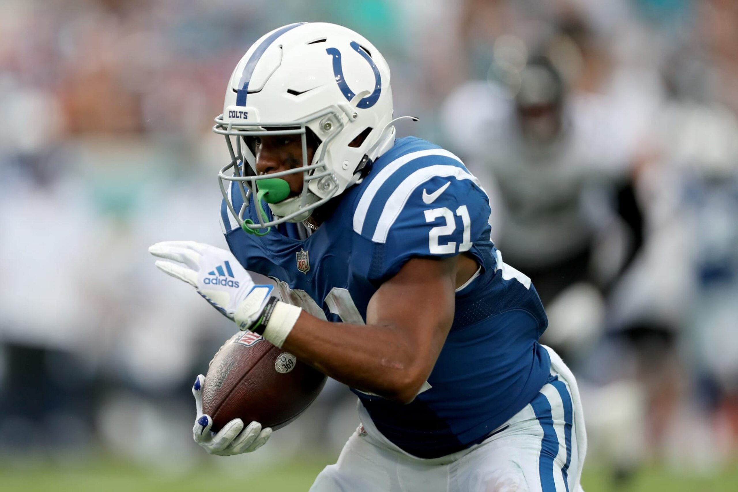 JACKSONVILLE, FLORIDA - SEPTEMBER 18: Nyheim Hines #21 of the Indianapolis Colts carries the ball in the fourth quarter against the Jacksonville Jaguars at TIAA Bank Field on September 18, 2022 in Jacksonville, Florida. (Photo by Courtney Culbreath/Getty Images)