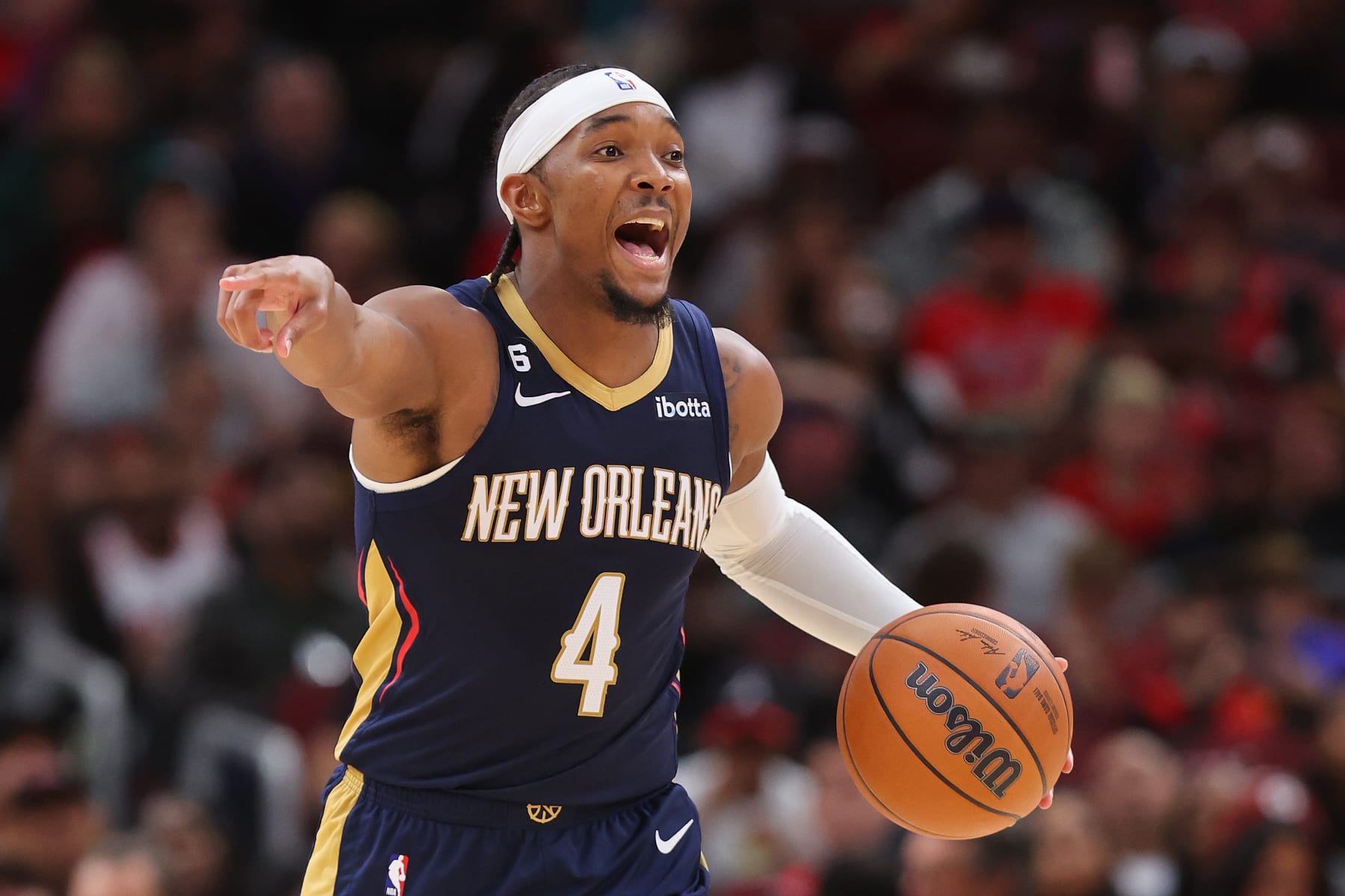 CHICAGO, ILLINOIS - OCTOBER 04: Devonte' Graham #4 of the New Orleans Pelicans dribbles up the court against the Chicago Bulls during the second half of a preseason game at the United Center on October 04, 2022 in Chicago, Illinois.NOTE TO USER: User expressly acknowledges and agrees that, by downloading and or using this photograph, User is consenting to the terms and conditions of the Getty Images License Agreement. (Photo by Michael Reaves/Getty Images)
