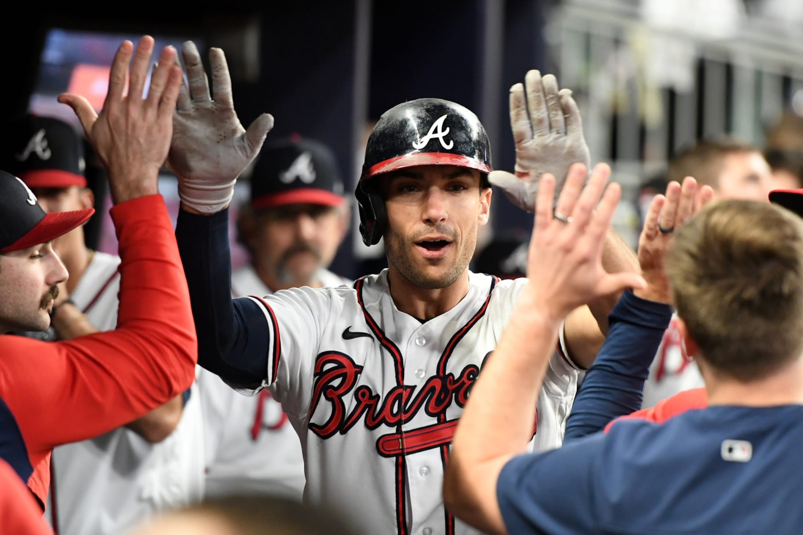 ATLANTA, GA - OCTOBER 2: Matt Olson #28 of the Atlanta Braves celebrates with teammates after hitting a home run against the New York Mets during the sixth inning at Truist Park on October 2, 2022 in Atlanta, Georgia. (Photo by Adam Hagy/Getty Images)