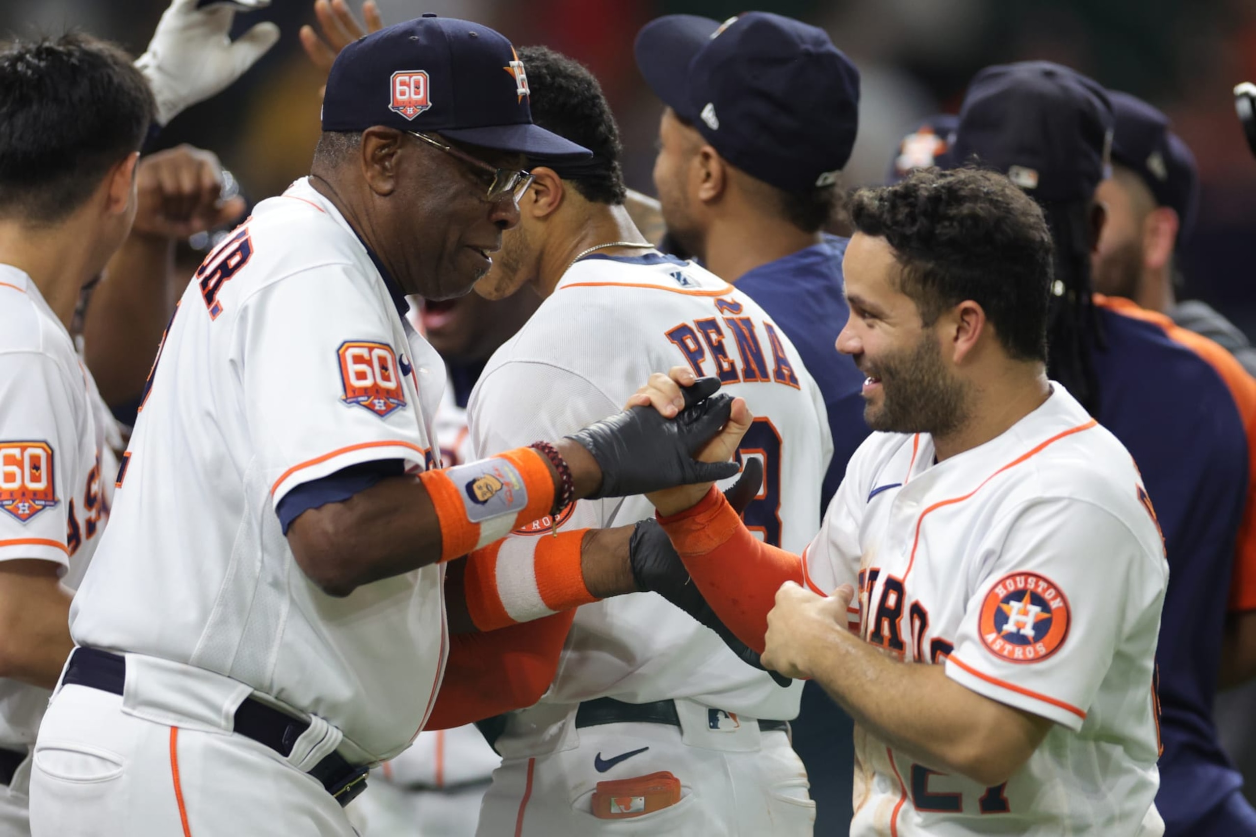 HOUSTON, TEXAS - SEPTEMBER 07: Dusty Baker Jr. #12 of the Houston Astros talks with Jose Altuve #27 after they defeat the Texas Rangers 4-3 at Minute Maid Park on September 07, 2022 in Houston, Texas. (Photo by Carmen Mandato/Getty Images)