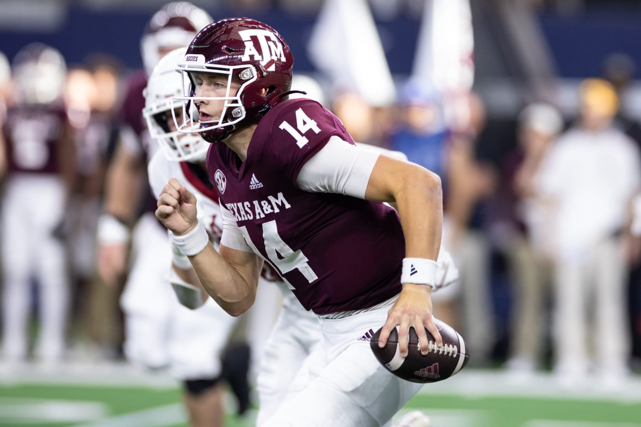 ARLINGTON, TX - SEPTEMBER 24: Texas A&M Aggies quarterback Max Johnson (#14) runs up field during the Southwest Classic college football game between the Texas A&M Aggies and the Arkansas Razorbacks on September 24, 2022 at AT&T Stadium in Arlington, TX.  (Photo by Matthew Visinsky/Icon Sportswire via Getty Images)