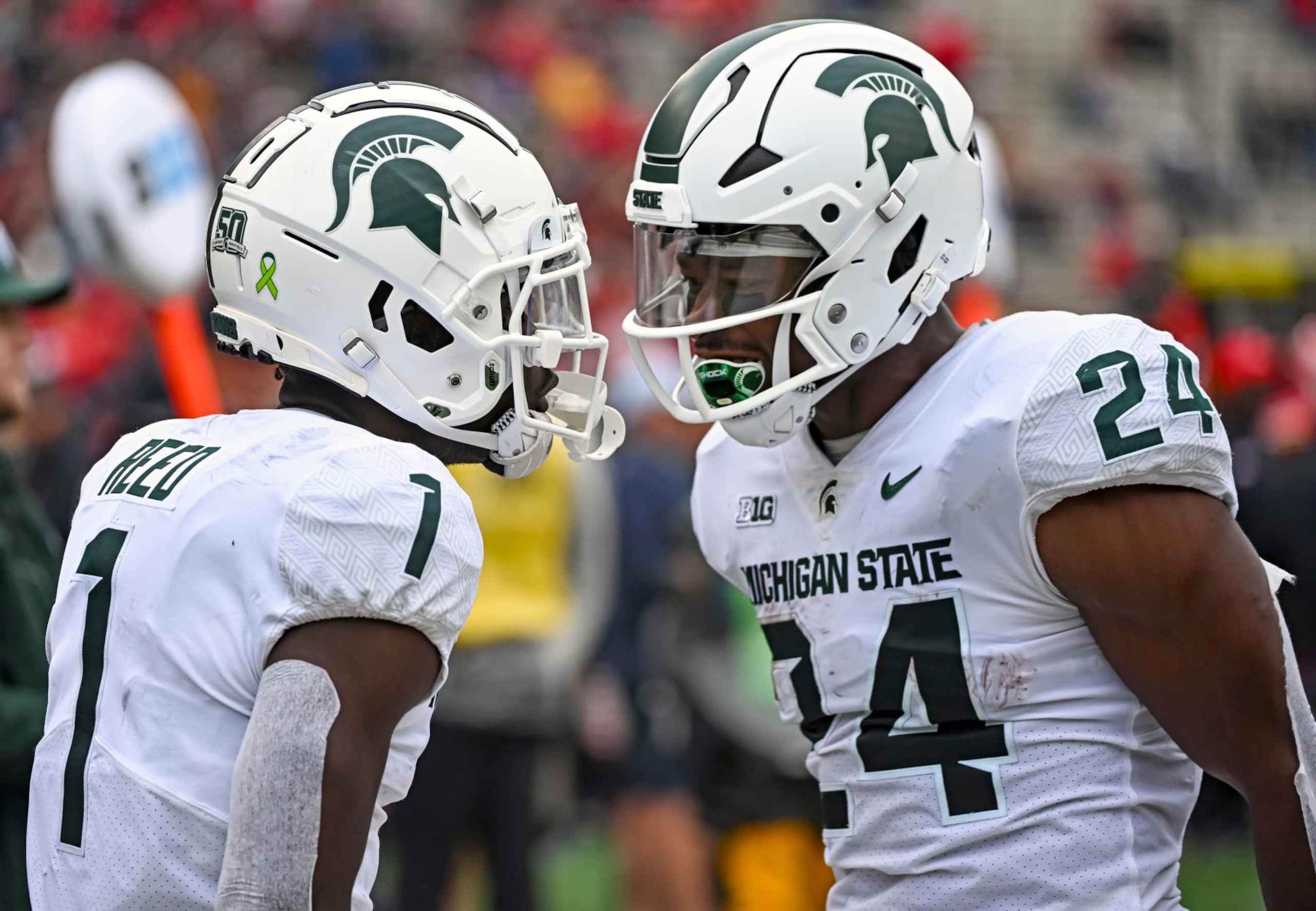 COLLEGE PARK, MD - OCTOBER 01: Michigan State Spartans wide receiver Jayden Reed (1) celebrated his touchdown reception with running back Elijah Collins (24) during the Michigan State Spartans game versus the Maryland Terrapins on October 1, 2022 at SECU Stadium in College Park, MD.  (Photo by Mark Goldman/Icon Sportswire via Getty Images)