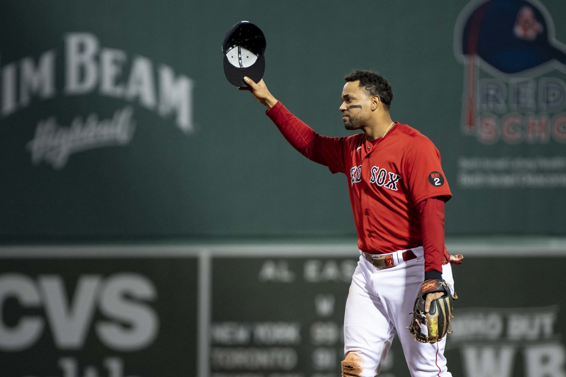BOSTON, MA - OCTOBER 5: Xander Bogaerts #2 of the Boston Red Sox salutes the fans as he exits the game during the seventh inning of a game against the Tampa Bay Rays on October 5, 2022 at Fenway Park in Boston, Massachusetts. (Photo by Billie Weiss/Boston Red Sox/Getty Images)