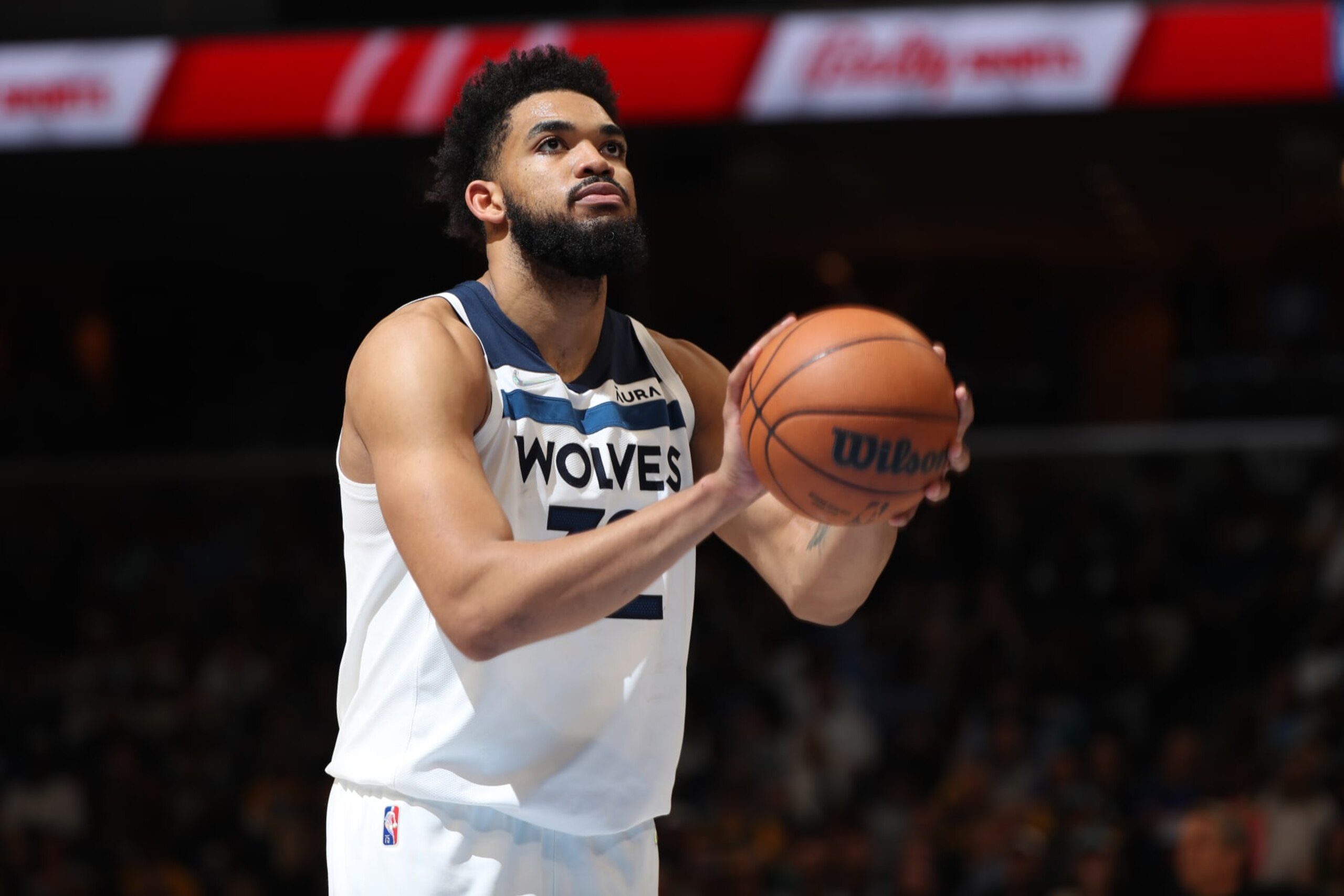 MEMPHIS, TN - APRIL 26: Karl-Anthony Towns #32 of the Minnesota Timberwolves shoots a free throw against the Memphis Grizzlies during Round 1 Game 5 of the 2022 NBA Playoffs on April 26, 2022 at FedExForum in Memphis, Tennessee. NOTE TO USER: User expressly acknowledges and agrees that, by downloading and or using this photograph, User is consenting to the terms and conditions of the Getty Images License Agreement. Mandatory Copyright Notice: Copyright 2022 NBAE (Photo by Joe Murphy/NBAE via Getty Images)