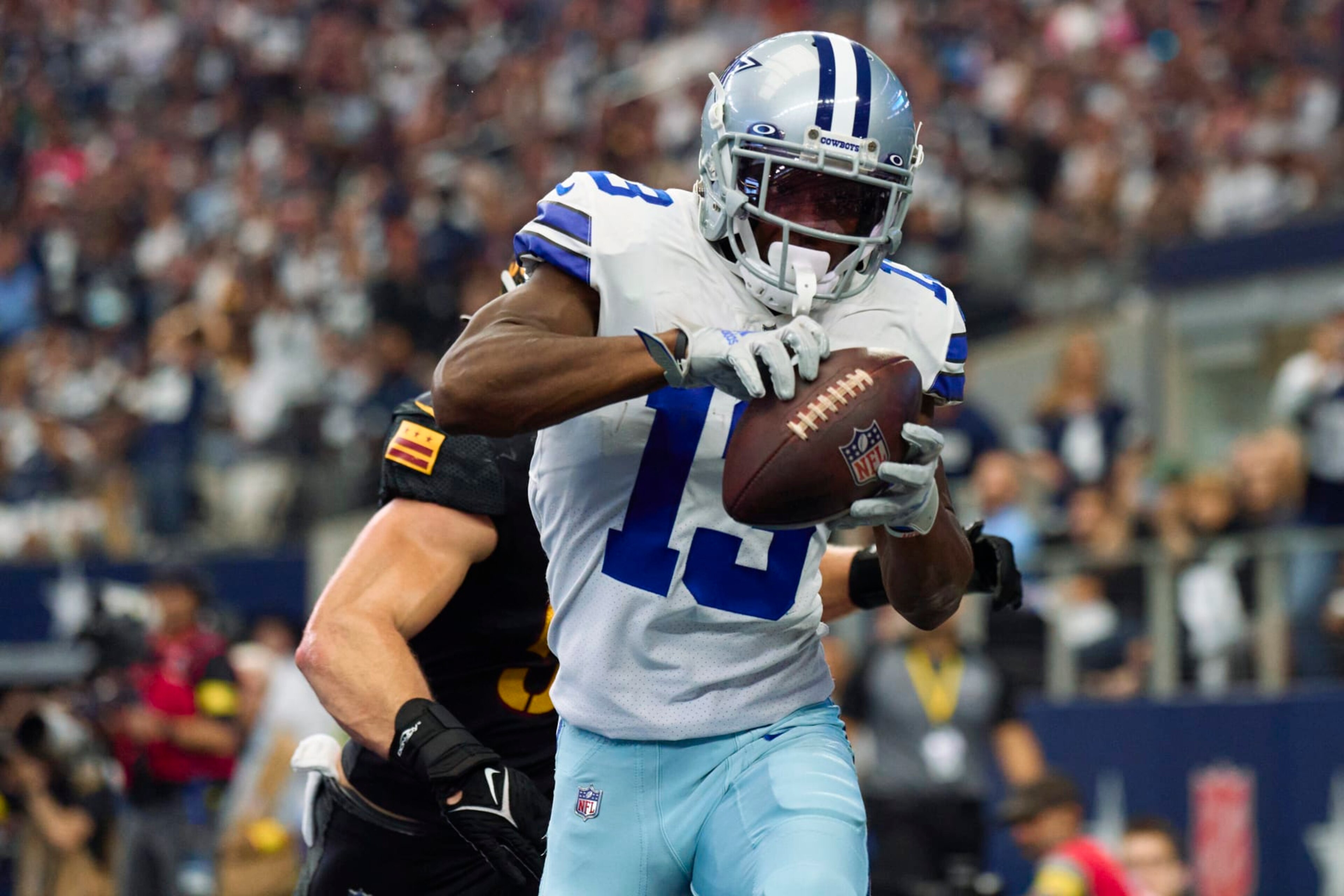 ARLINGTON, TX - OCTOBER 02: Michael Gallup #13 of the Dallas Cowboys catches a touchdown pass against the Washington Commanders at AT&T Stadium on October 2, 2022 in Arlington, Texas. (Photo by Cooper Neill/Getty Images) ARLINGTON, TX - OCTOBER 02: Michael Gallup #13 of the Dallas Cowboys catches a touchdown pass against the Washington Commanders at AT&T Stadium on October 2, 2022 in Arlington, Texas. (Photo by Cooper Neill/Getty Images)