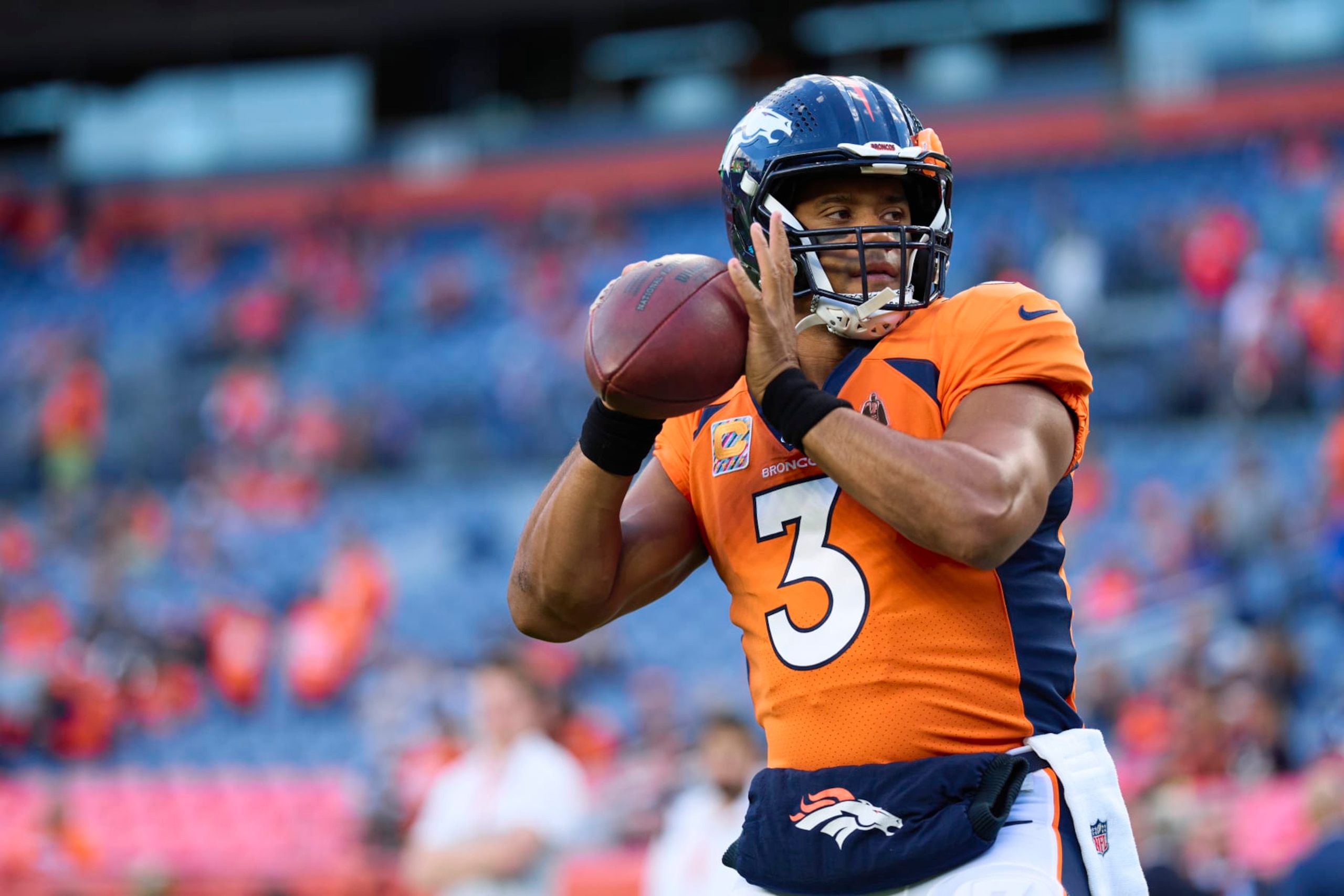 DENVER, CO - OCTOBER 06: Russell Wilson #3 of the Denver Broncos warms up before kickoff against the Indianapolis Colts at Empower Field at Mile High on October 6, 2022 in Denver, Colorado. (Photo by Cooper Neill/Getty Images)