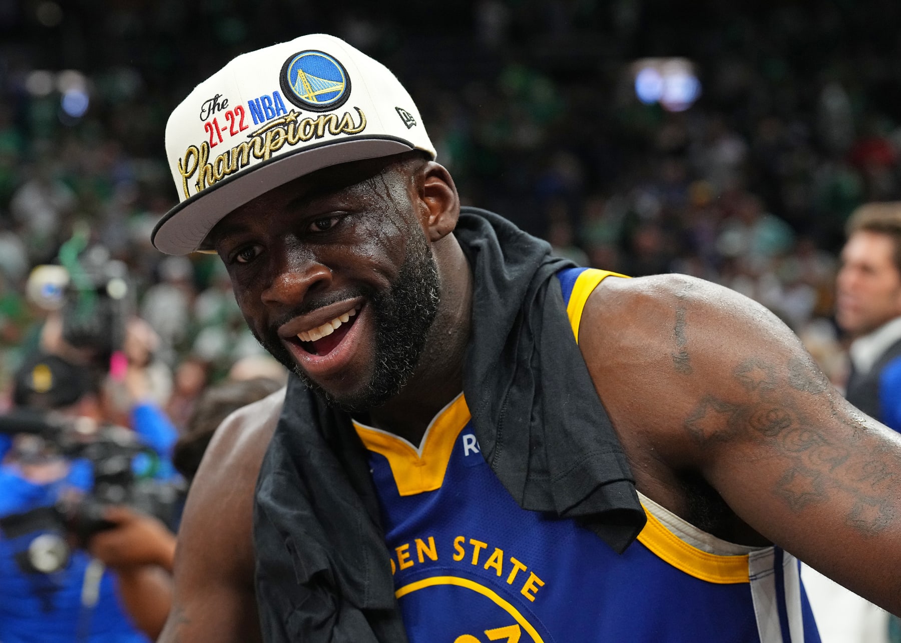 BOSTON, MA - JUNE 16: Draymond Green #23 of the Golden State Warriors smiles and celebrates on stage after winning Game Six of the 2022 NBA Finals against the Boston Celtics on June 16, 2022 at TD Garden in Boston, Massachusetts. NOTE TO USER: User expressly acknowledges and agrees that, by downloading and or using this photograph, user is consenting to the terms and conditions of Getty Images License Agreement. Mandatory Copyright Notice: Copyright 2022 NBAE (Photo by Garrett Ellwood/NBAE via Getty Images)