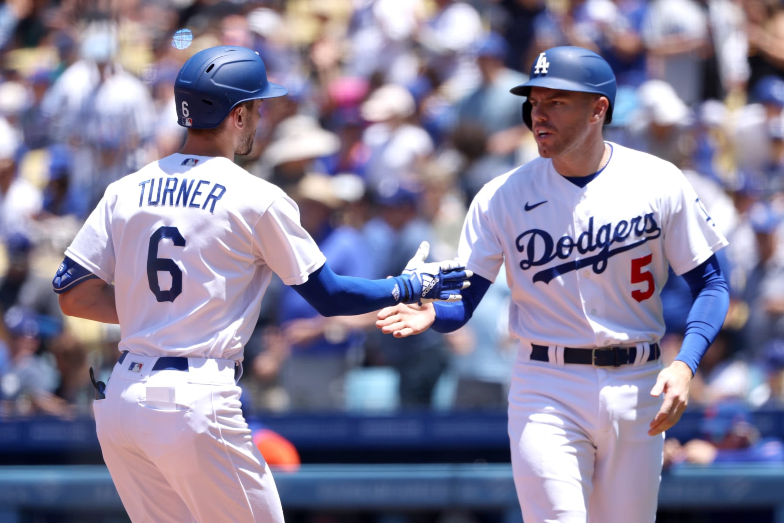 LOS ANGELES, CALIFORNIA - JUNE 05: Trea Turner #6 of the Los Angeles Dodgers celebrates his two run home run with teammate Freddie Freeman #5 during the first inning against the New York Mets at Dodger Stadium on June 05, 2022 in Los Angeles, California. (Photo by Katelyn Mulcahy/Getty Images)
