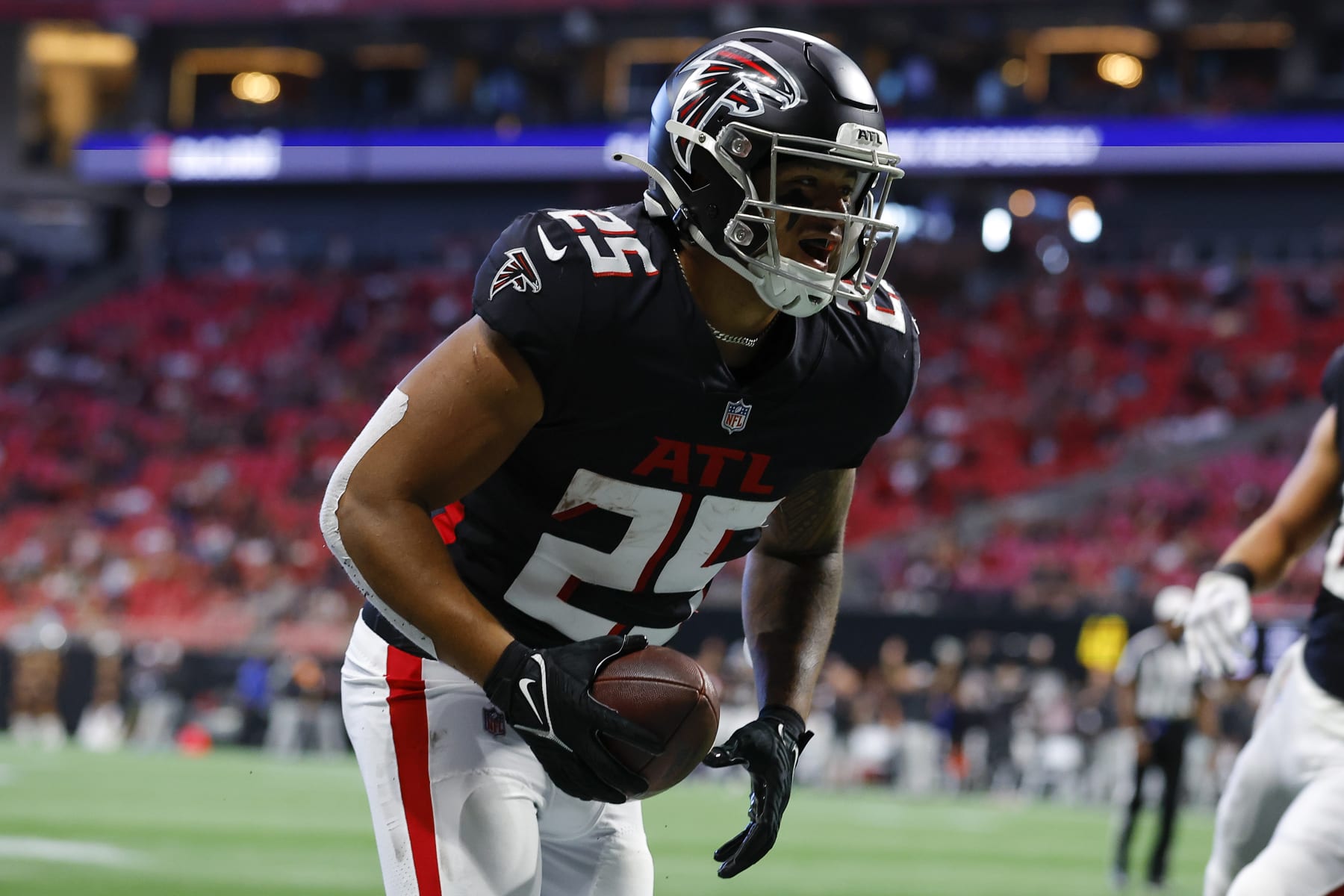 ATLANTA, GA - AUGUST 27: Tyler Allgeier #25 of the Atlanta Falcons reacts after scoring a touchdown during the first half of the preseason game against the Jacksonville Jaguars at Mercedes-Benz Stadium on August 27, 2022 in Atlanta, Georgia. (Photo by Todd Kirkland/Getty Images)