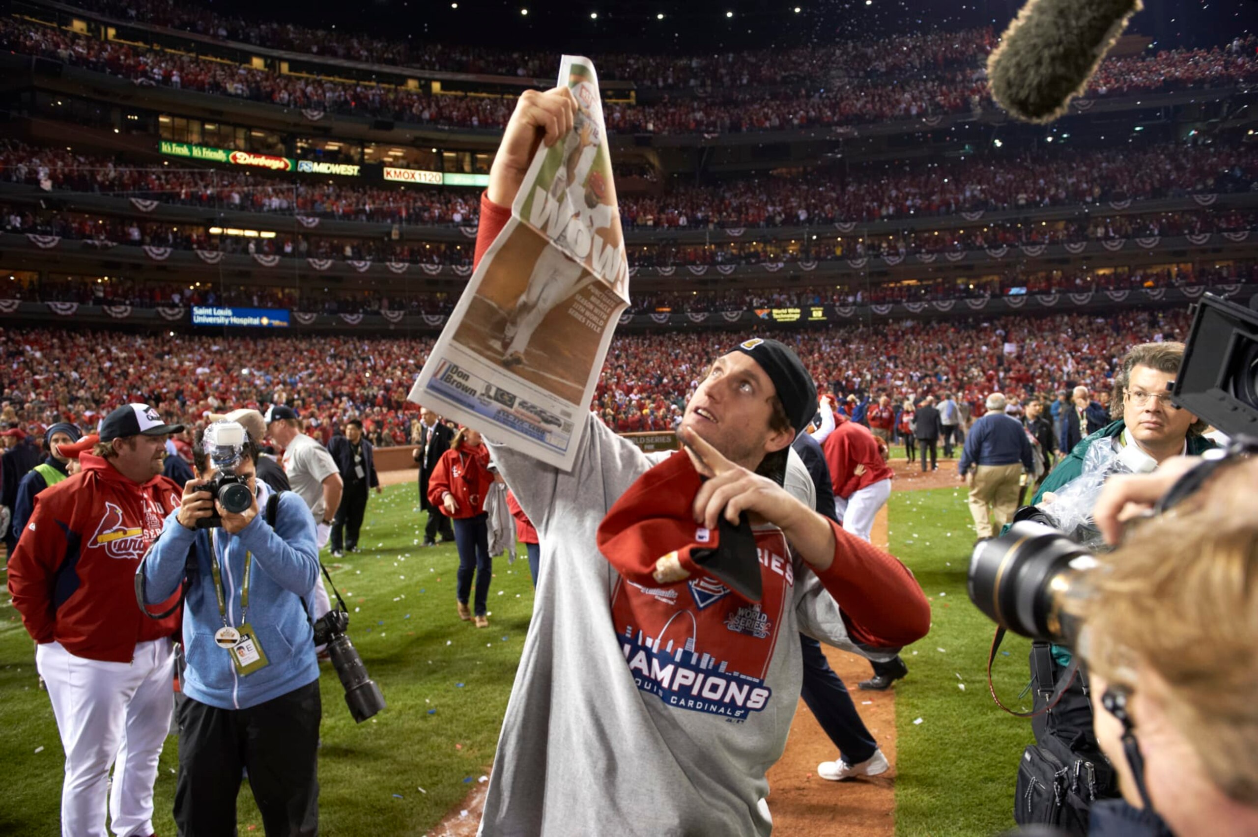 Baseball: World Series: St. Louis Cardinals David Freese (23) victorious on field, holding newspaper with headline reading WOW!, after game vs Texas Rangers at Busch Stadium. Game 7.
St. Louis, MO 10/28/2011
CREDIT: David E. Klutho (Photo by David E. Klutho /Sports Illustrated via Getty Images)
(Set Number: X86551 TK4 R4 F131 )