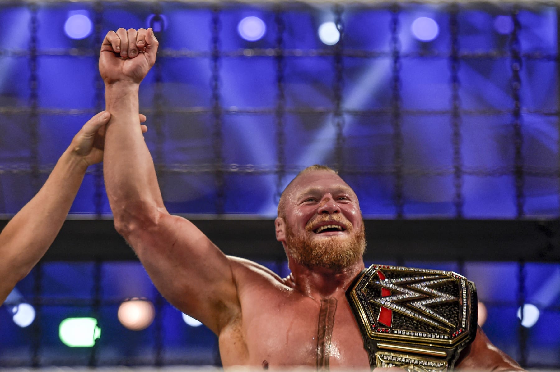 Brock Lesnar is declared champion following the 2022 World Wrestling Entertainment (WWE) Elimination Chamber at the Jeddah Super Dome in Saudi Arabia's Red Sea coastal city of Jeddah on February 19, 2022. (Photo by Amer HILABI / AFP) (Photo by AMER HILABI/AFP via Getty Images)