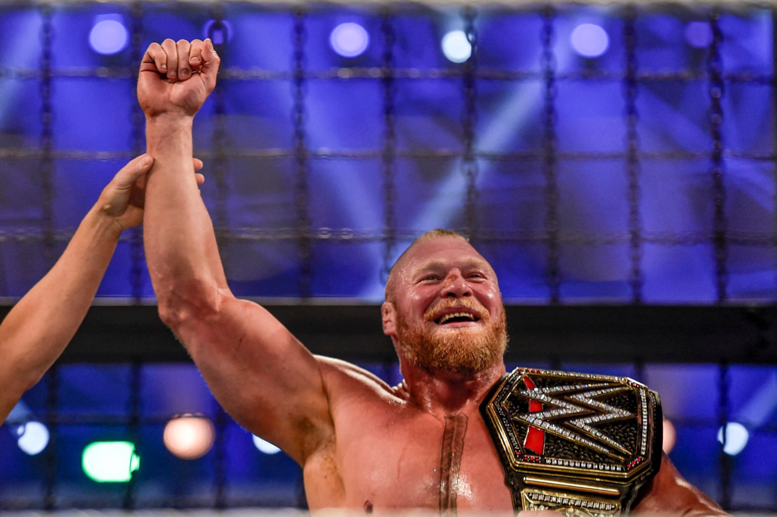 Brock Lesnar is declared champion following the 2022 World Wrestling Entertainment (WWE) Elimination Chamber at the Jeddah Super Dome in Saudi Arabia's Red Sea coastal city of Jeddah on February 19, 2022. (Photo by Amer HILABI / AFP) (Photo by AMER HILABI/AFP via Getty Images)