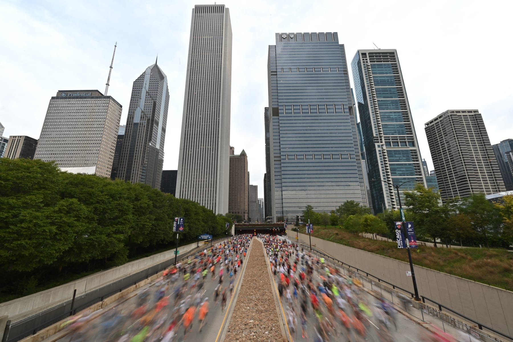 CHICAGO, ILLINOIS - OCTOBER 10:  Runners head down head down South Columbus Drive at the start of the 2021 Chicago Marathon on October 10, 2021 in Chicago, Illinois.  (Photo by Jamie Sabau/Getty Images)
