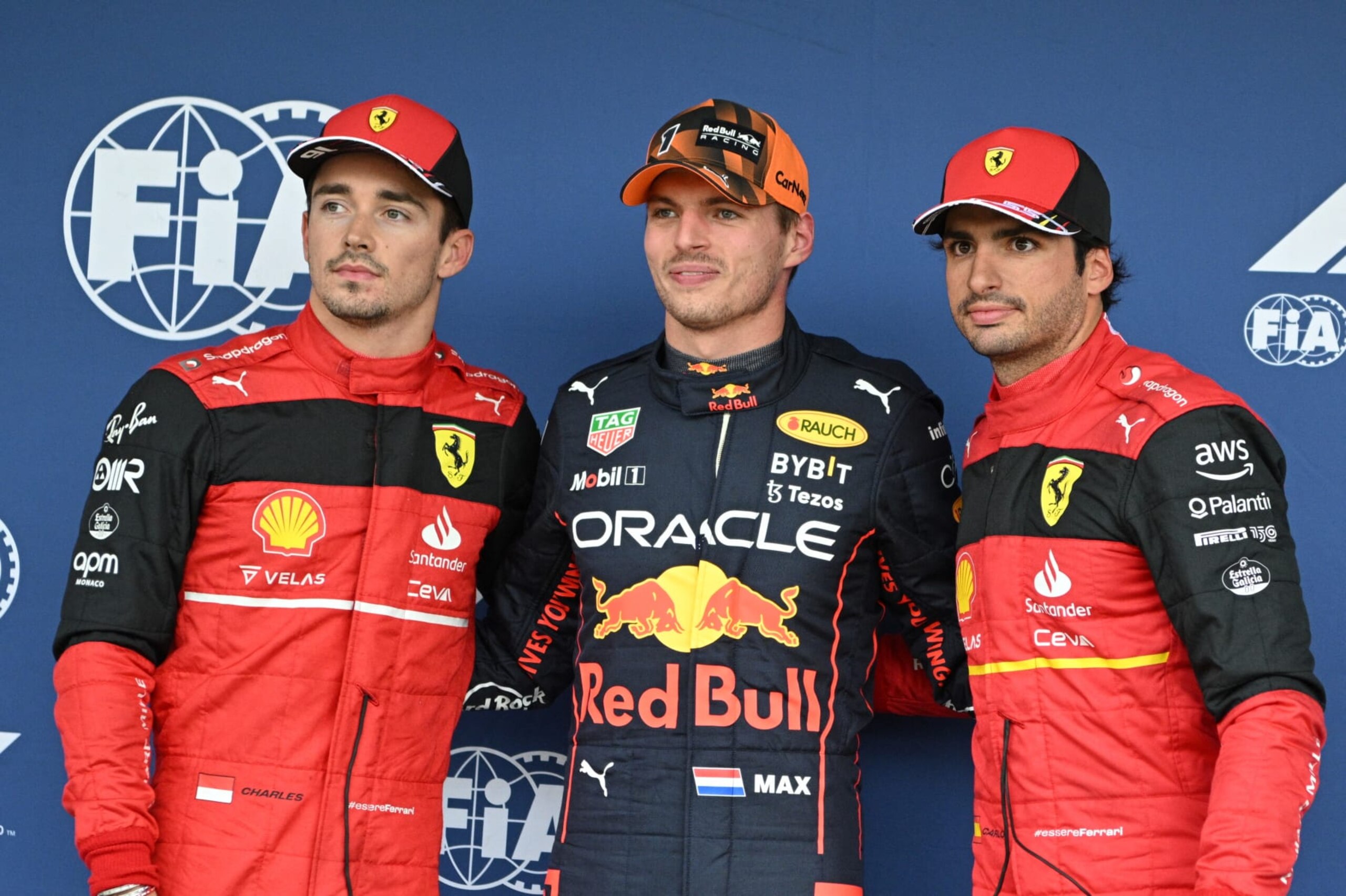 Pole position winner Red Bull Racing's Dutch driver Max Verstappen (C) poses with second-placed Ferrari's Monegasque driver Charles Leclerc (L) and third Ferrari's Spanish driver Carlos Sainz Jr after the qualifying session ahead of the Formula One Japanese Grand Prix at Suzuka, Mie prefecture on October 8, 2022. (Photo by Philip FONG / AFP) (Photo by PHILIP FONG/AFP via Getty Images)