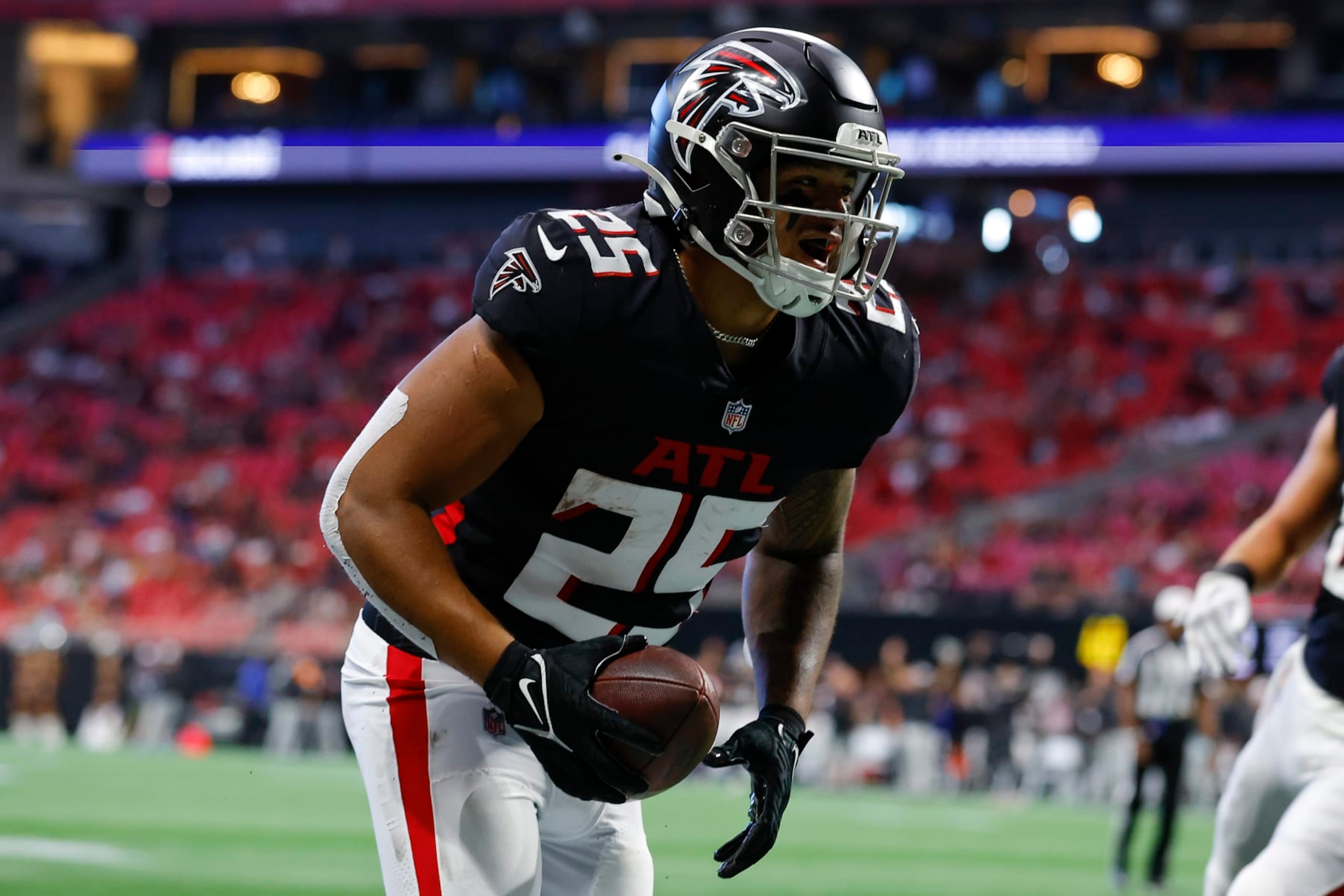 ATLANTA, GA - AUGUST 27: Tyler Allgeier #25 of the Atlanta Falcons reacts after scoring a touchdown during the first half of the preseason game against the Jacksonville Jaguars at Mercedes-Benz Stadium on August 27, 2022 in Atlanta, Georgia. (Photo by Todd Kirkland/Getty Images)