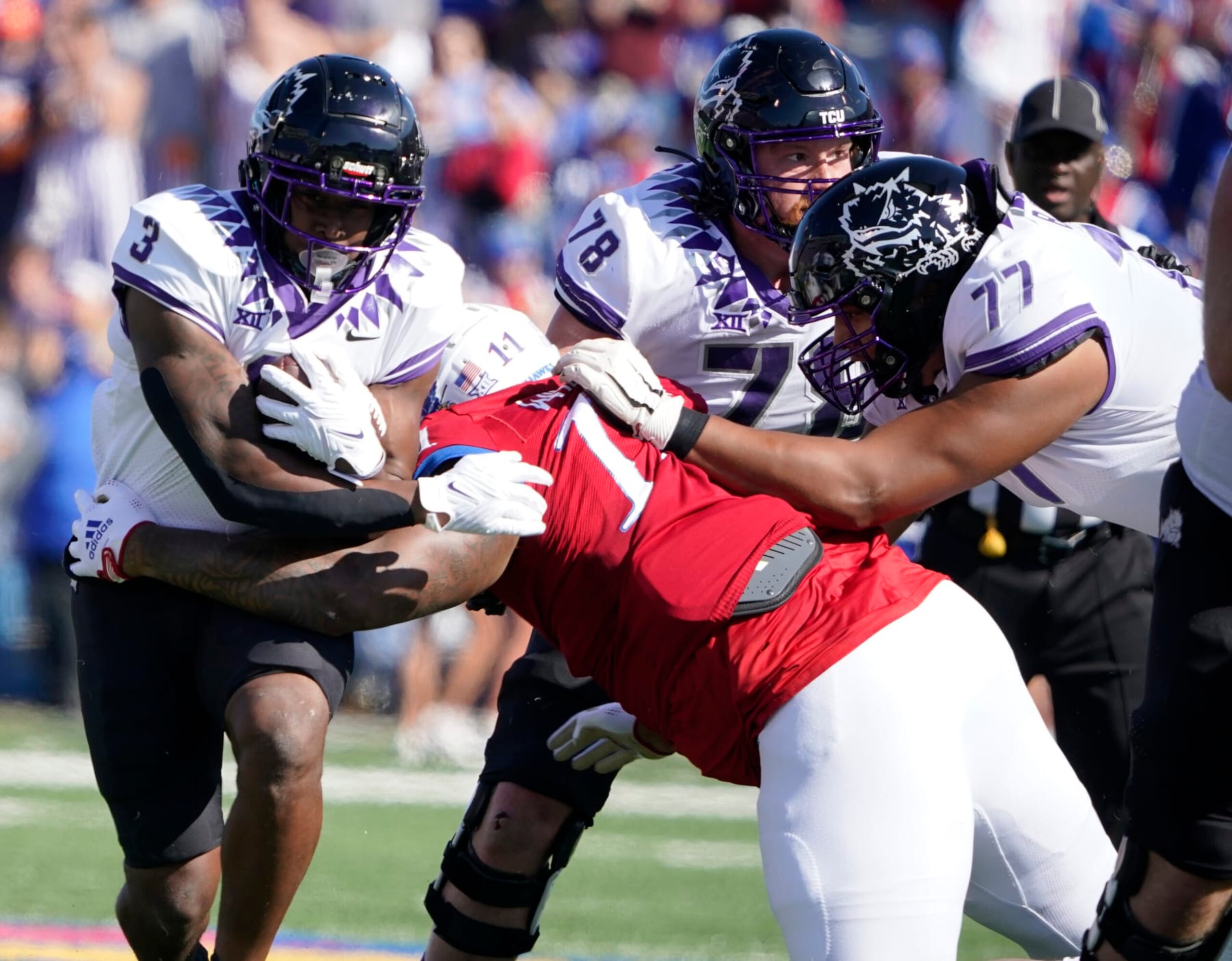 LAWRENCE, KANSAS - OCTOBER 08: Running back Emari Demercado #3 of the TCU Horned Frogs rushes against defensive lineman Eddie Wilson #11 of the Kansas Jayhawks in the first half at David Booth Kansas Memorial Stadium on October 08, 2022 in Lawrence, Kansas. (Photo by Ed Zurga/Getty Images) LAWRENCE, KANSAS - OCTOBER 08: Running back Emari Demercado #3 of the TCU Horned Frogs rushes against defensive lineman Eddie Wilson #11 of the Kansas Jayhawks in the first half at David Booth Kansas Memorial Stadium on October 08, 2022 in Lawrence, Kansas. (Photo by Ed Zurga/Getty Images)