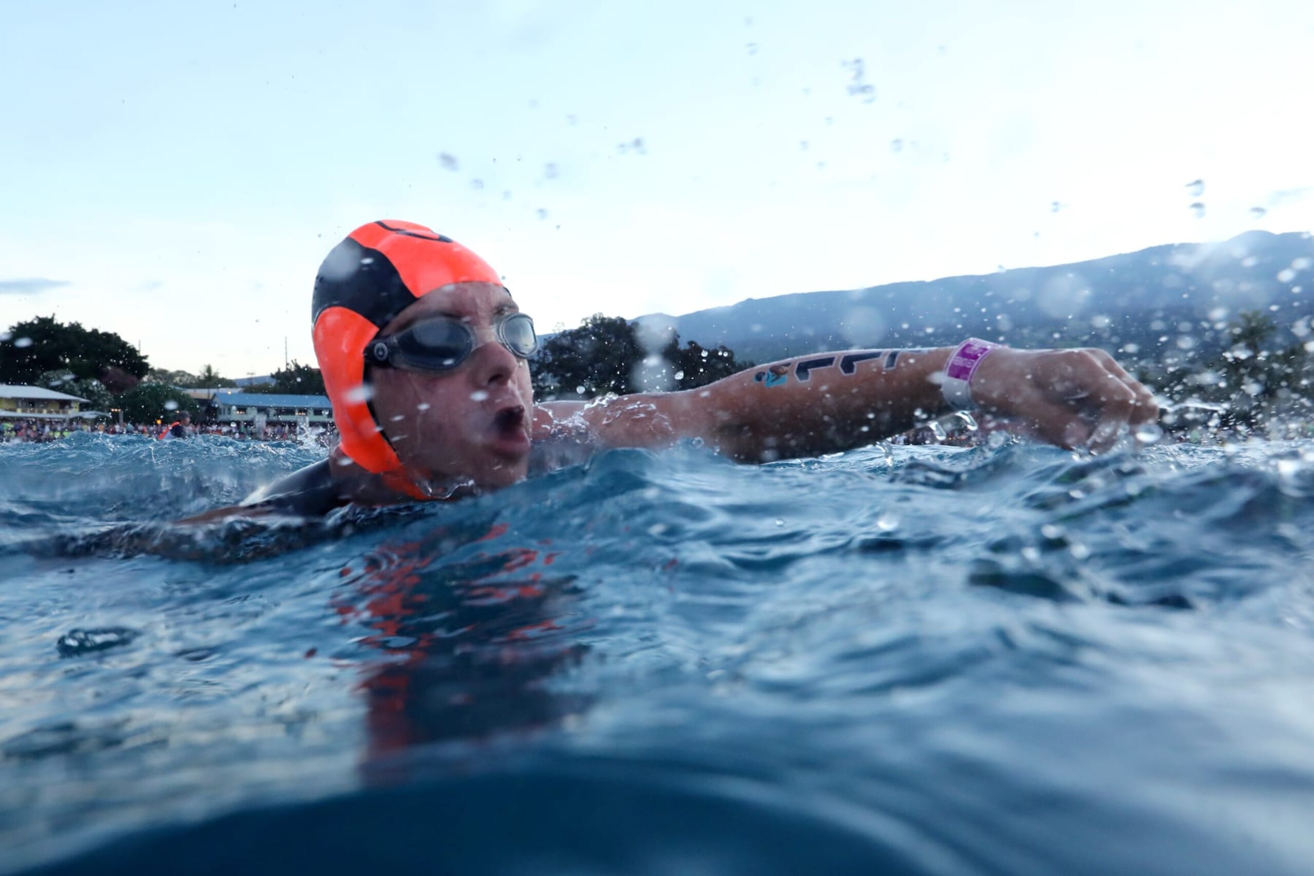 KAILUA KONA, HAWAII - OCTOBER 06: Chris Nikic swims to the start line during the Ironman World Championships on October 06, 2022 in Kailua Kona, Hawaii. (Photo by Tom Pennington/Getty Images for IRONMAN)