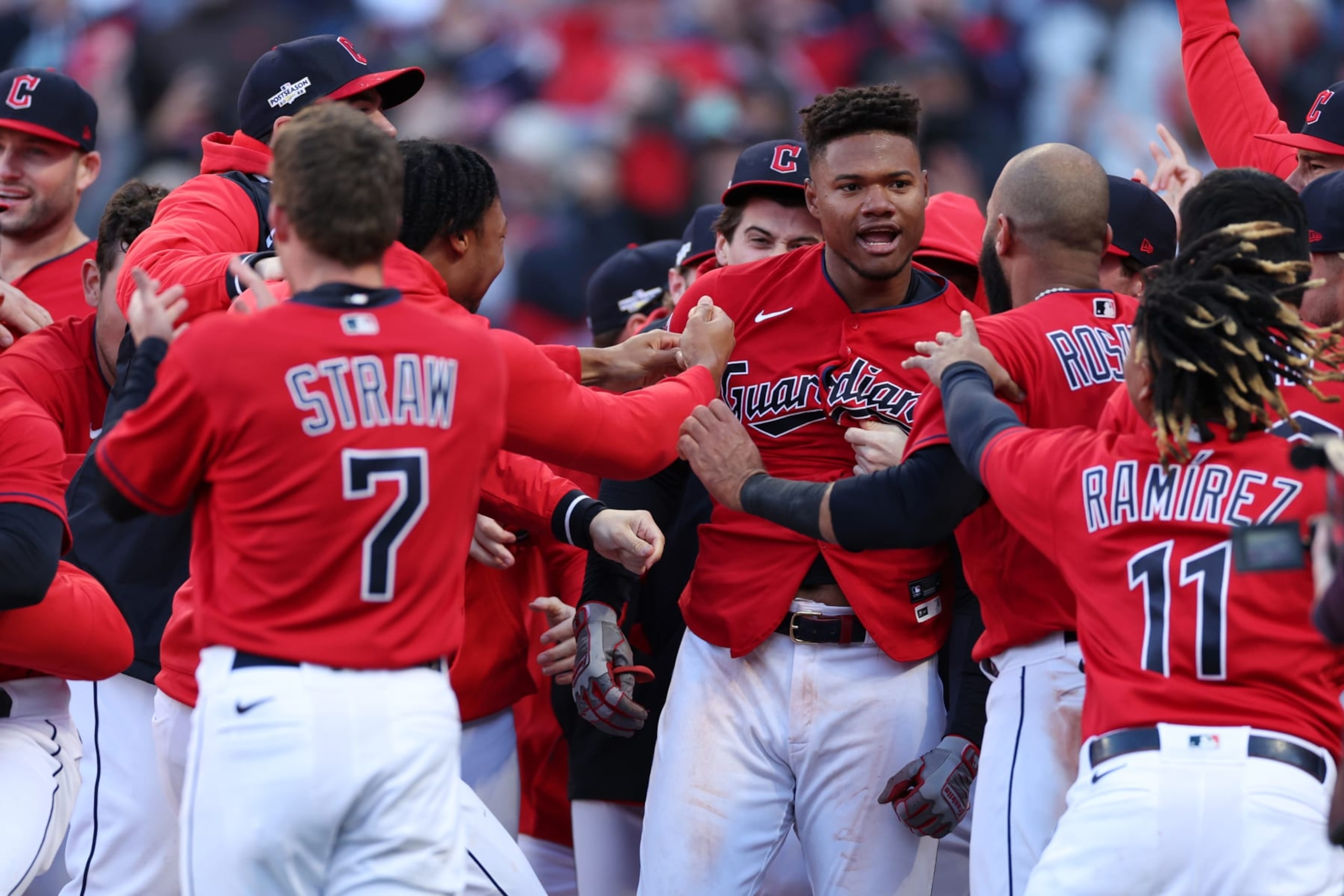 CLEVELAND, OHIO - OCTOBER 08: Oscar Gonzalez #39 of the Cleveland Guardians celebrates with teammates after hitting a walk-off home run to end the game in the fifteenth inning against the Tampa Bay Rays in game two of the Wild Card Series at Progressive Field on October 08, 2022 in Cleveland, Ohio. (Photo by Patrick Smith/Getty Images)