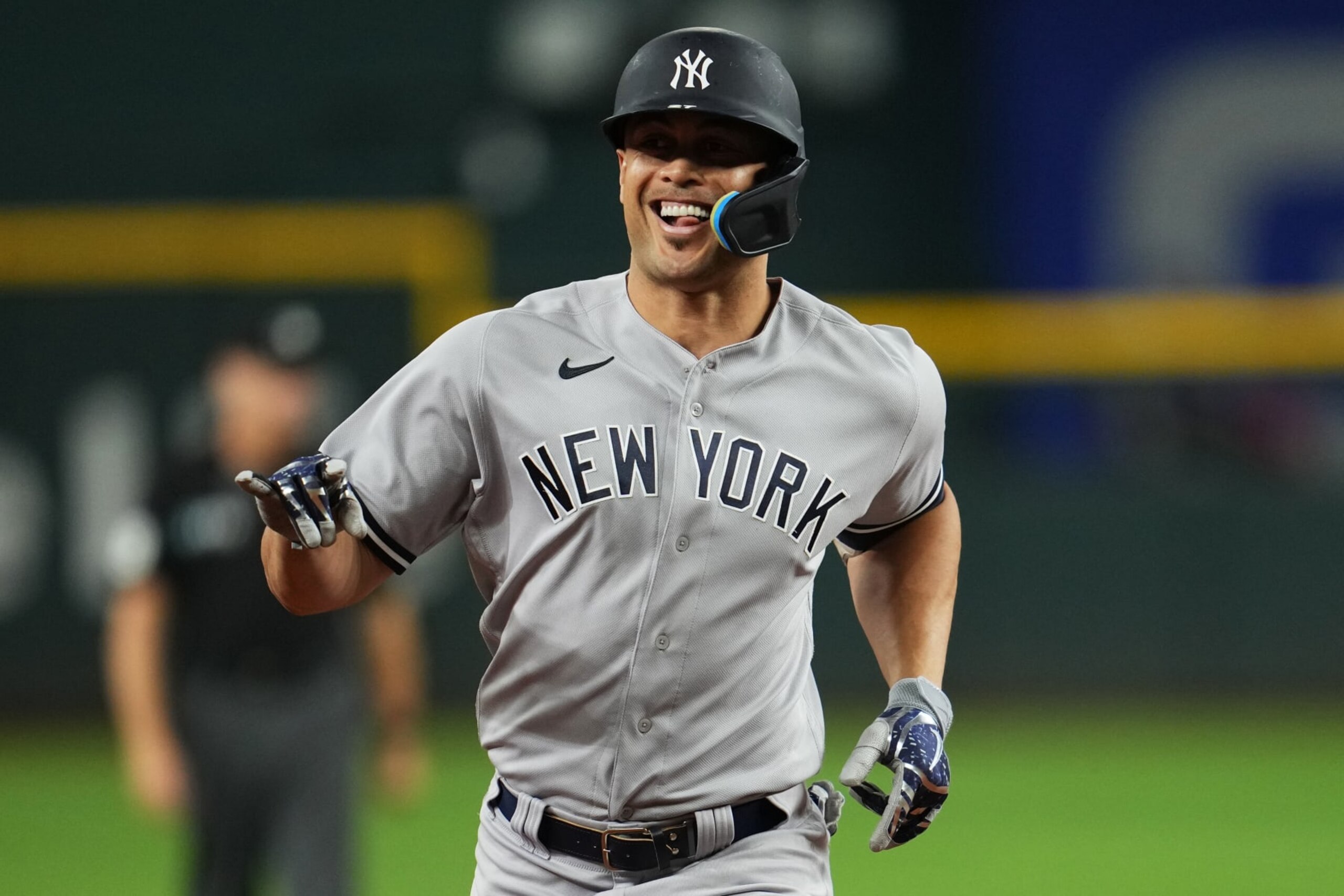ARLINGTON, TX - OCTOBER 04: Giancarlo Stanton #27 of the New York Yankees rounds the bases after hitting a home run in the fifth inning during the game between the New York Yankees and the Texas Rangers at Globe Life Field on Tuesday, October 4, 2022 in Arlington, Texas. (Photo by Cooper Neill/MLB Photos via Getty Images)