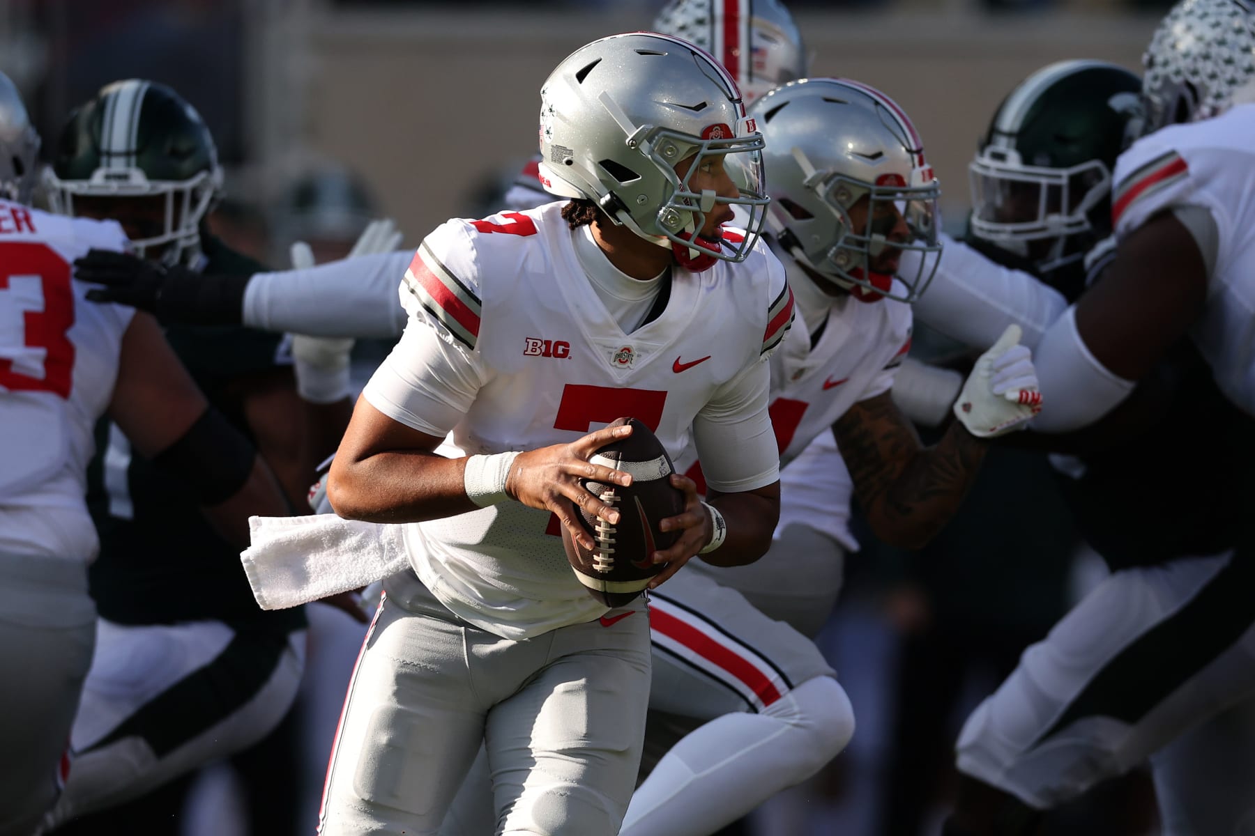EAST LANSING, MICHIGAN - OCTOBER 08: C.J. Stroud #7 of the Ohio State Buckeyes looks for a open receiver while playing the Michigan State Spartans at Spartan Stadium on October 08, 2022 in East Lansing, Michigan. (Photo by Gregory Shamus/Getty Images)