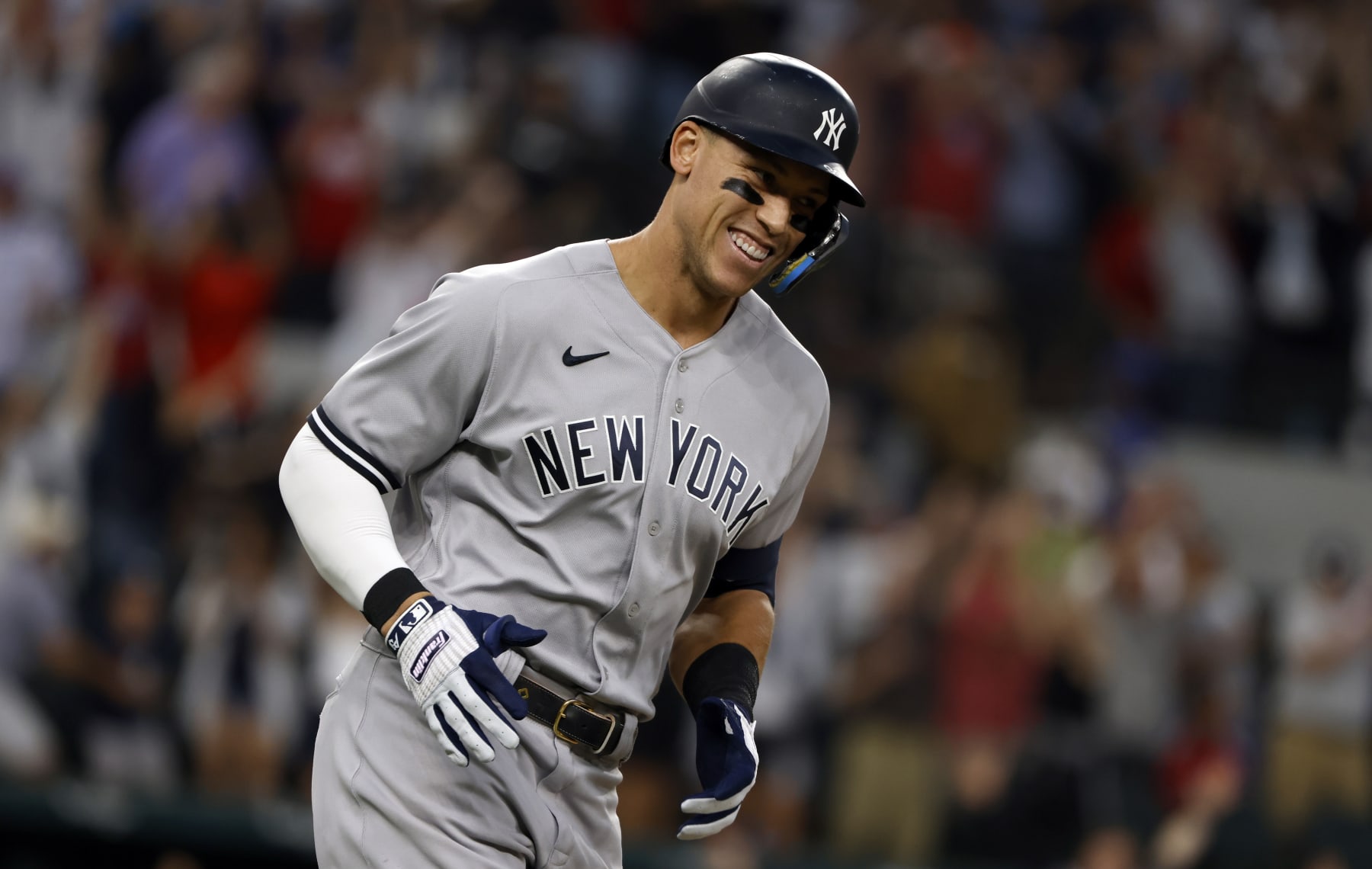 ARLINGTON, TX - OCTOBER 4: 
Aaron Judge #99 of the New York Yankees rounds the bases after hitting his 62nd home run of the season against the Texas Rangers during the first inning in game two of a double header at Globe Life Field on October 4, 2022 in Arlington, Texas. Judge has now set the American League record for home runs in a single season. (Photo by Ron Jenkins/Getty Images)