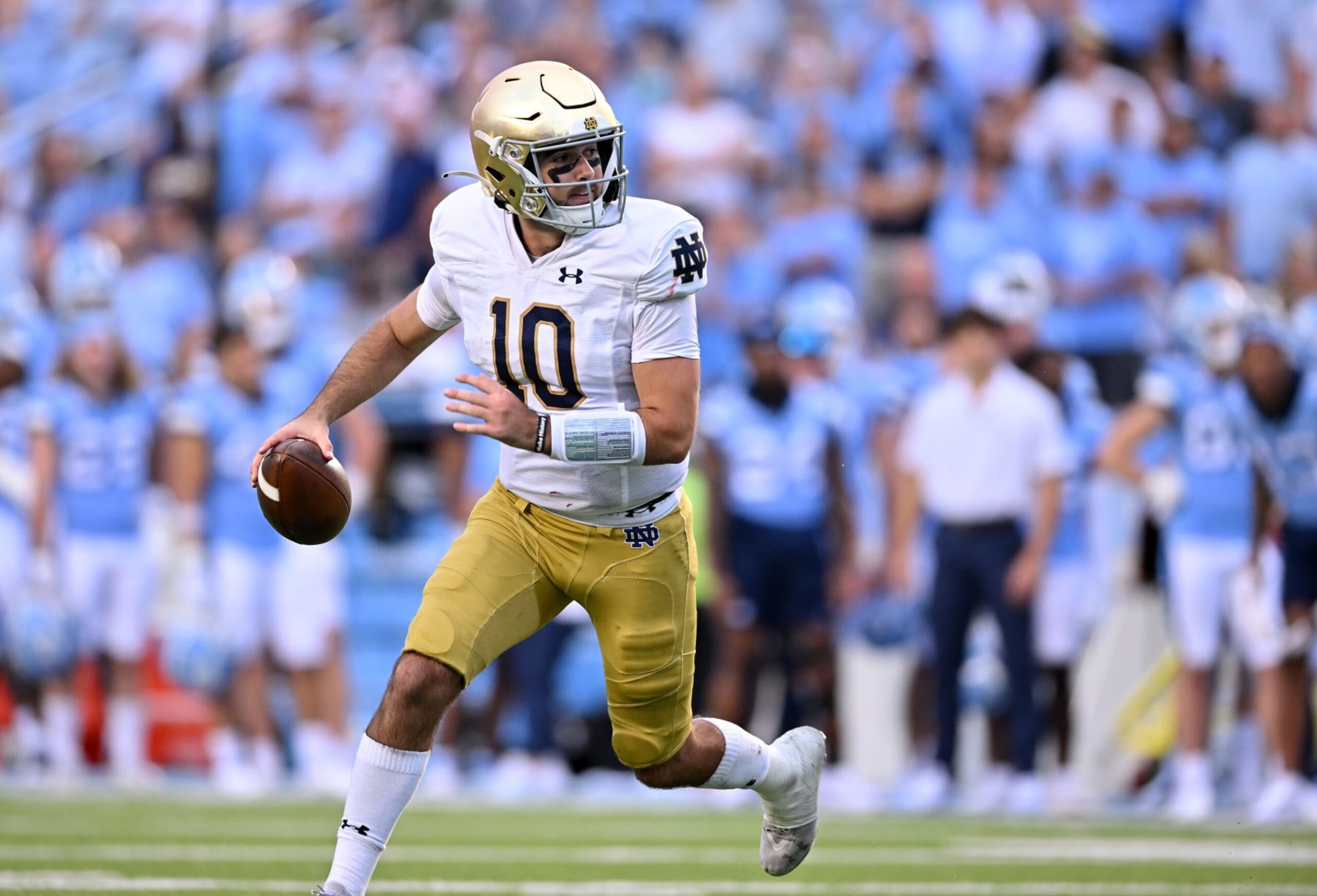 CHAPEL HILL, NORTH CAROLINA - SEPTEMBER 24: Drew Pyne #10 of the Notre Dame Fighting Irish rolls out  against the North Carolina Tar Heels during the second half of their game at Kenan Memorial Stadium on September 24, 2022 in Chapel Hill, North Carolina. Notre Dame won 45-32. (Photo by Grant Halverson/Getty Images)
