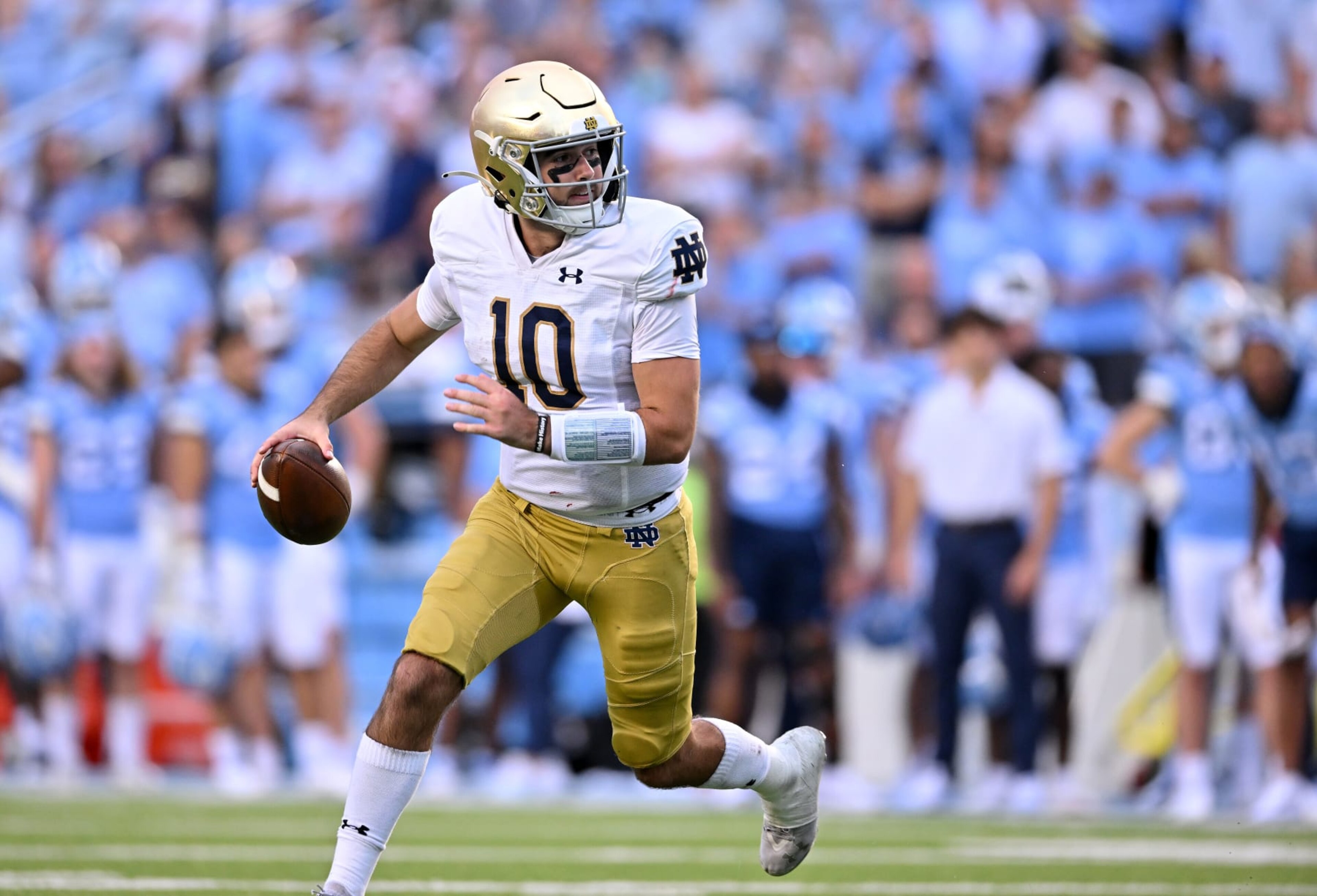 CHAPEL HILL, NORTH CAROLINA - SEPTEMBER 24: Drew Pyne #10 of the Notre Dame Fighting Irish rolls out  against the North Carolina Tar Heels during the second half of their game at Kenan Memorial Stadium on September 24, 2022 in Chapel Hill, North Carolina. Notre Dame won 45-32. (Photo by Grant Halverson/Getty Images)