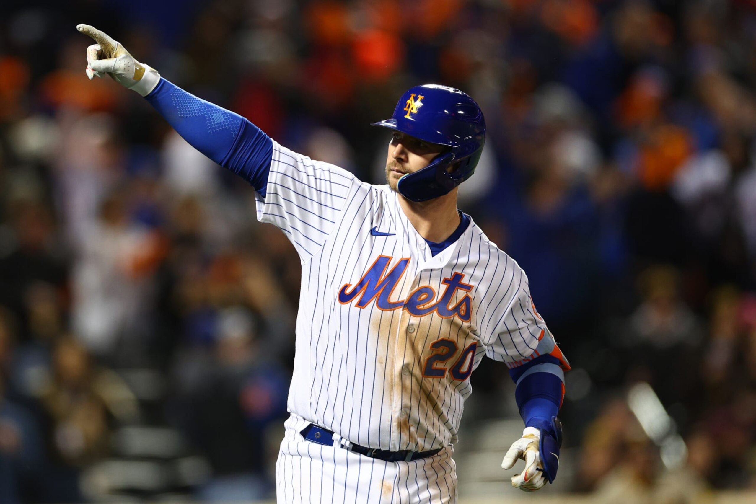 NEW YORK, NEW YORK - OCTOBER 08: Pete Alonso #20 of the New York Mets hits a solo home run off of Nick Martinez #21 of the San Diego Padres during the fifth inning in game two of the Wild Card Series at Citi Field on October 08, 2022 in New York City. (Photo by Elsa/Getty Images)