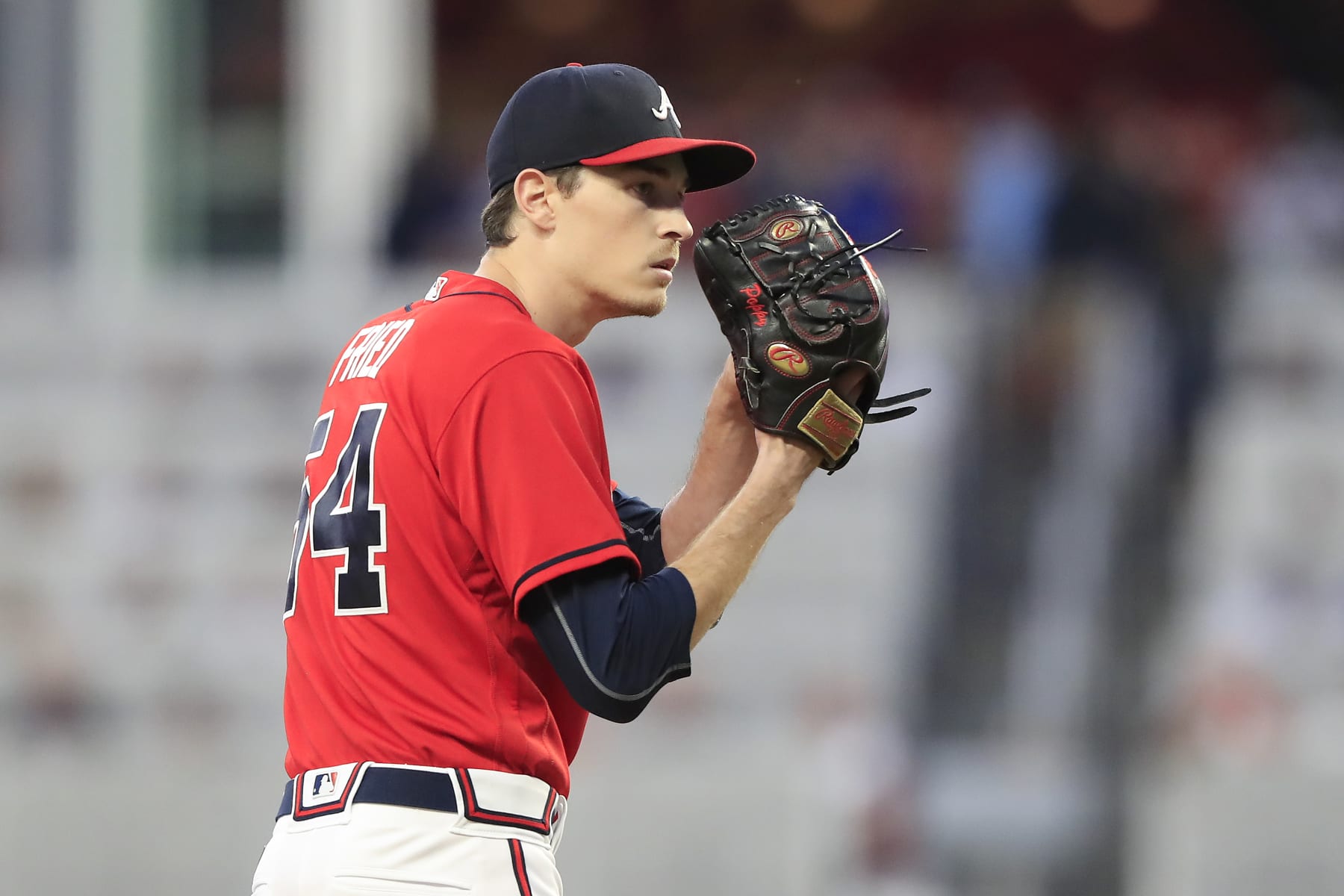 ATLANTA, GA - SEPTEMBER 30: Atlanta Braves starting pitcher Max Fried (54) prepares to deliver a pitch during the Friday evening MLB game between the New York Mets and the Atlanta Braves on September 30, 2022 at Truist Park in Atlanta, Georgia.  (Photo by David J. Griffin/Icon Sportswire via Getty Images)