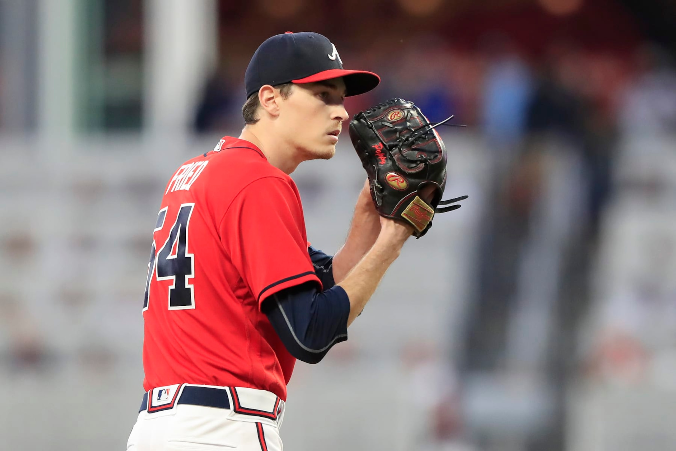 ATLANTA, GA - SEPTEMBER 30: Atlanta Braves starting pitcher Max Fried (54) prepares to deliver a pitch during the Friday evening MLB game between the New York Mets and the Atlanta Braves on September 30, 2022 at Truist Park in Atlanta, Georgia.  (Photo by David J. Griffin/Icon Sportswire via Getty Images)