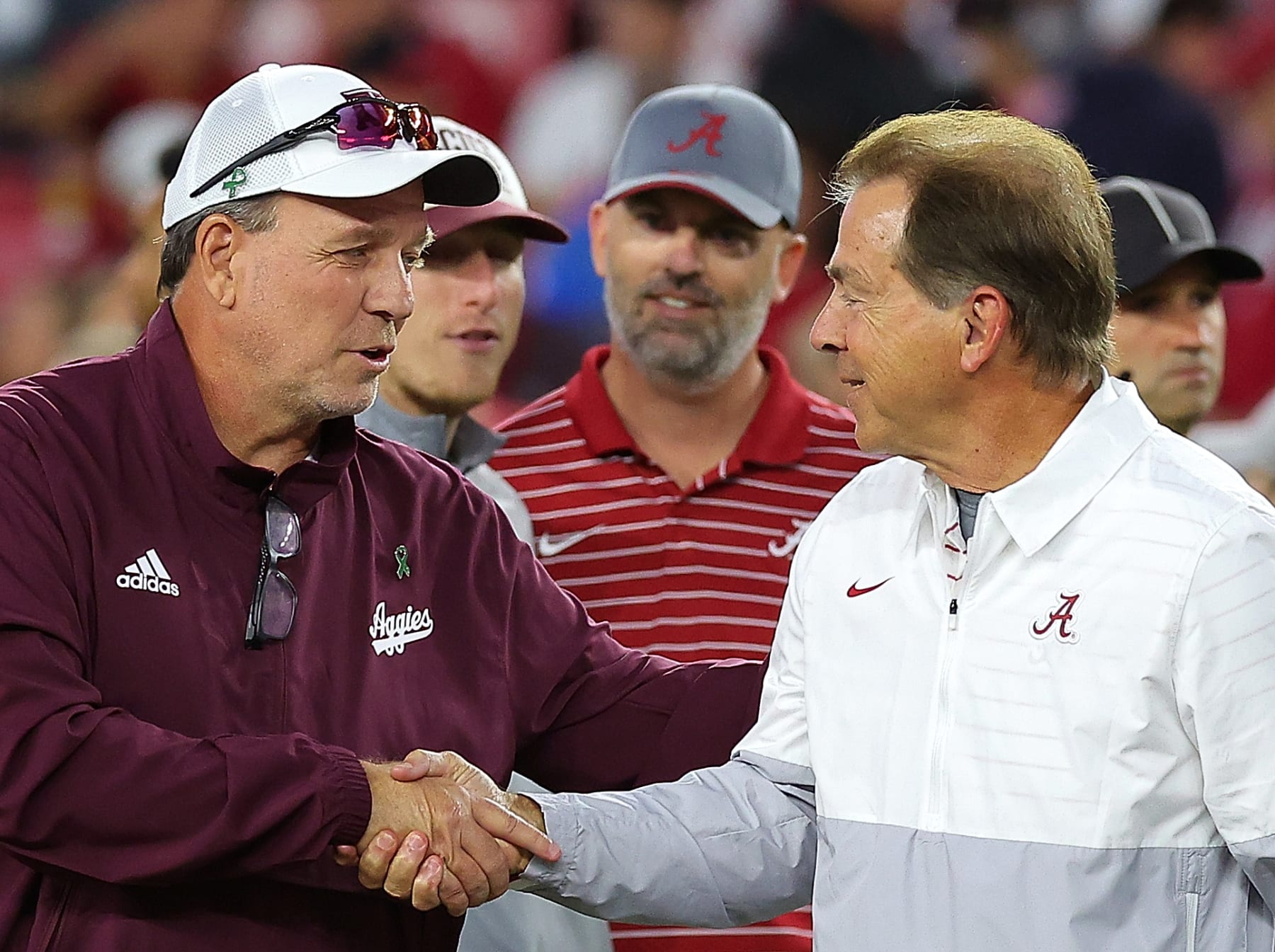TUSCALOOSA, ALABAMA - OCTOBER 08:  Head coach Jimbo Fisher of the Texas A&M Aggies and head coach Nick Saban of the Alabama Crimson Tide shake hands during pregame warmups at Bryant-Denny Stadium on October 08, 2022 in Tuscaloosa, Alabama. (Photo by Kevin C. Cox/Getty Images)