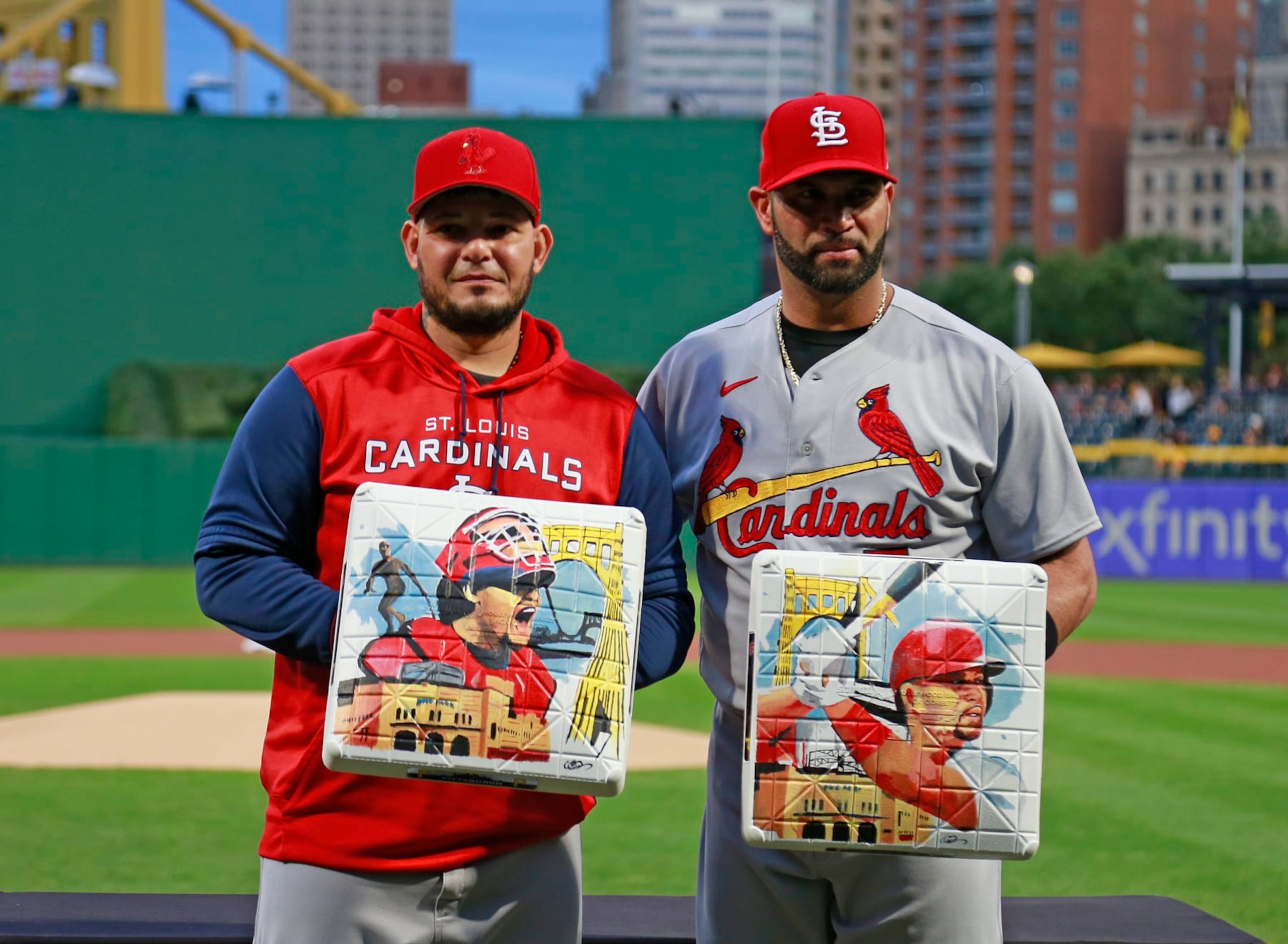 PITTSBURGH, PA - OCTOBER 04: (L-R)  Yadier Molina #4 of the St. Louis Cardinals and Albert Pujols #5 of the St. Louis Cardinals receive commemorative bases from the Pittsburgh Pirates in honor of their upcoming retirement from baseball before the game between the St. Louis Cardinals and the Pittsburgh Pirates at PNC Park on October 4, 2022 in Pittsburgh, Pennsylvania.  (Photo by Justin K. Aller/Getty Images)