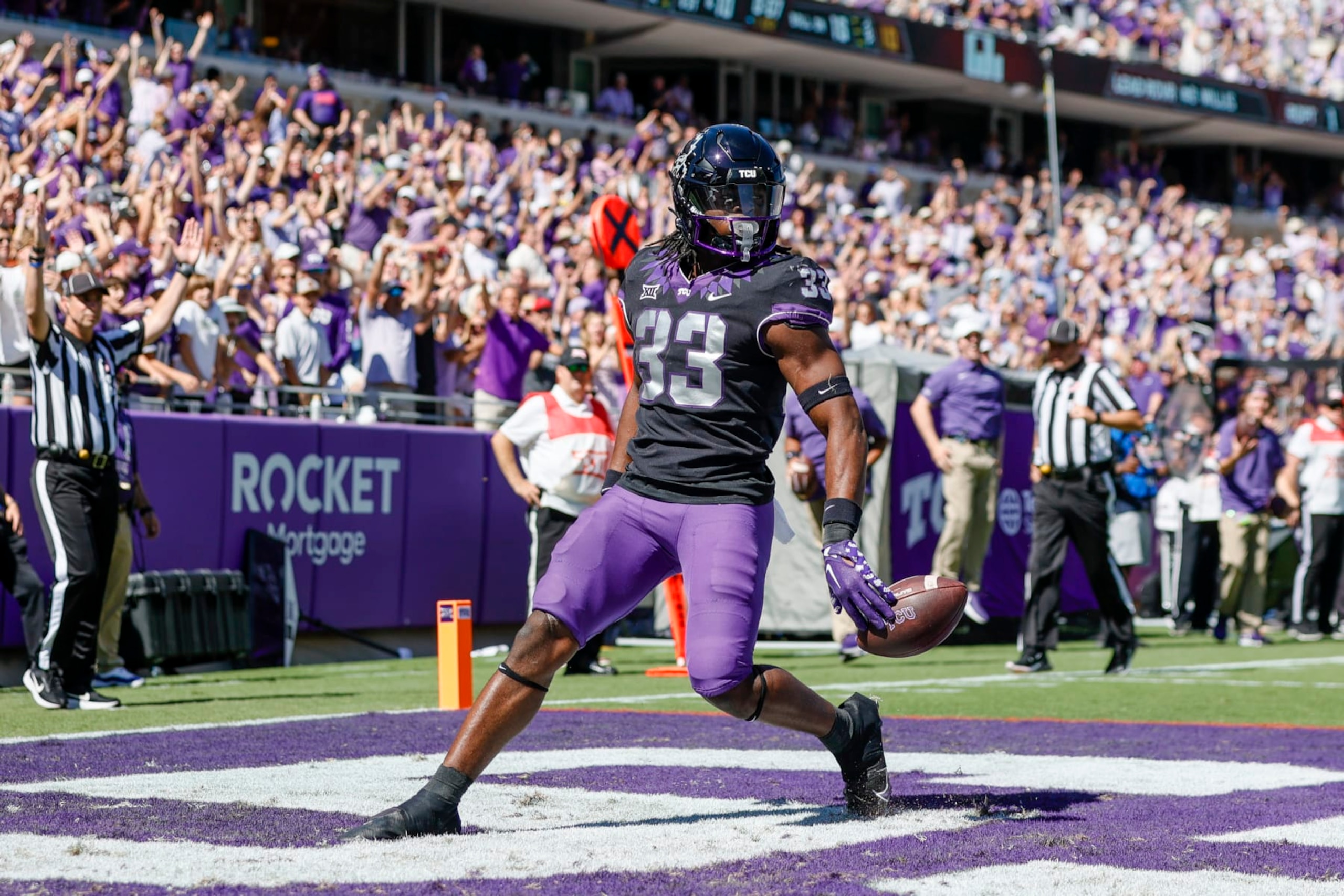 FORT WORTH, TX - OCTOBER 01: TCU Horned Frogs running back Kendre Miller (33) crosses the goal line scoring a touchdown during the game between the TCU Horned Frogs and the Oklahoma Sooners on October 1, 2022 at Amon G. Carter Stadium in Fort Worth, Texas. (Photo by Matthew Pearce/Icon Sportswire via Getty Images)