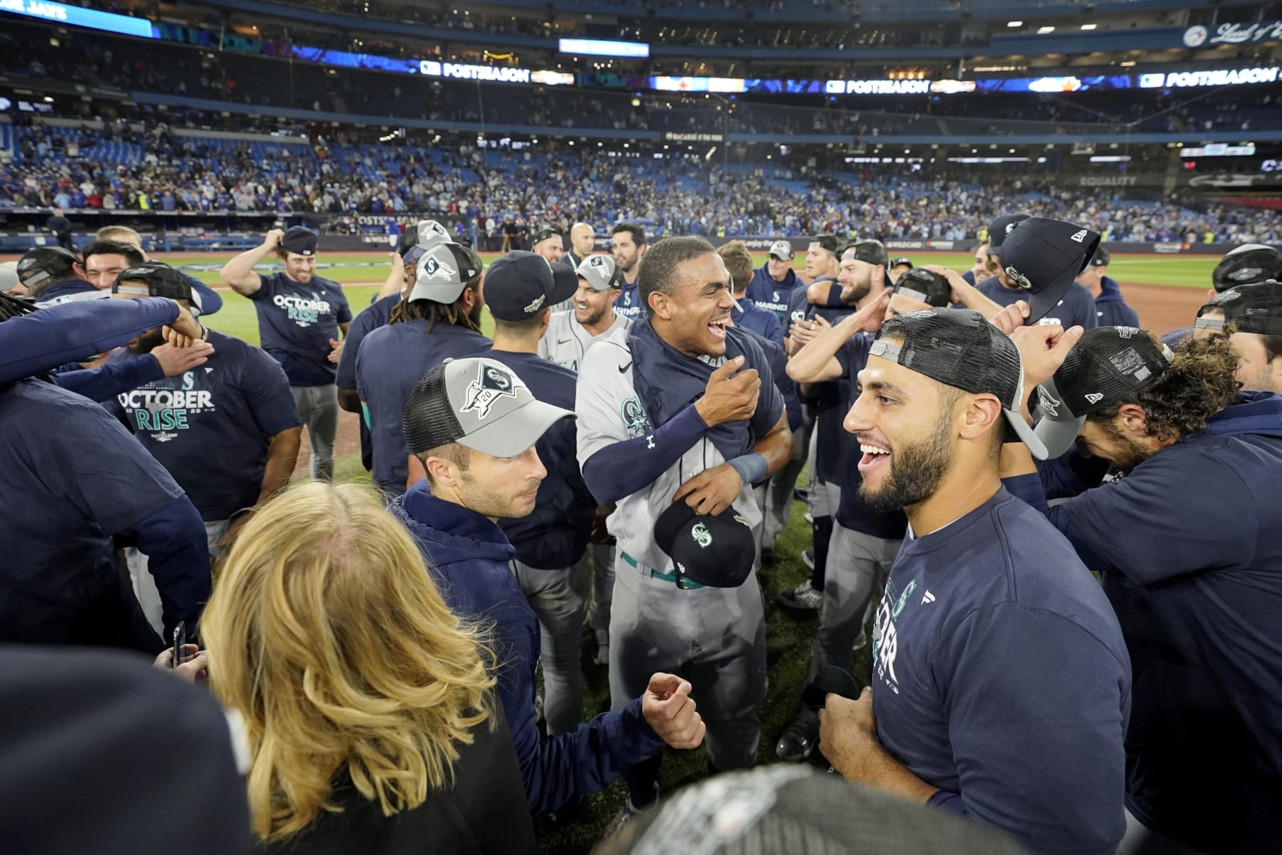 TORONTO, ONTARIO - OCTOBER 08: The Seattle Mariners celebrate after defeating the Toronto Blue Jays in game two to win the American League Wild Card Series at Rogers Centre on October 08, 2022 in Toronto, Ontario. The Seattle Mariners defeated the Toronto Blue Jays with a score of 10 to 9. (Photo by Mark Blinch/Getty Images)