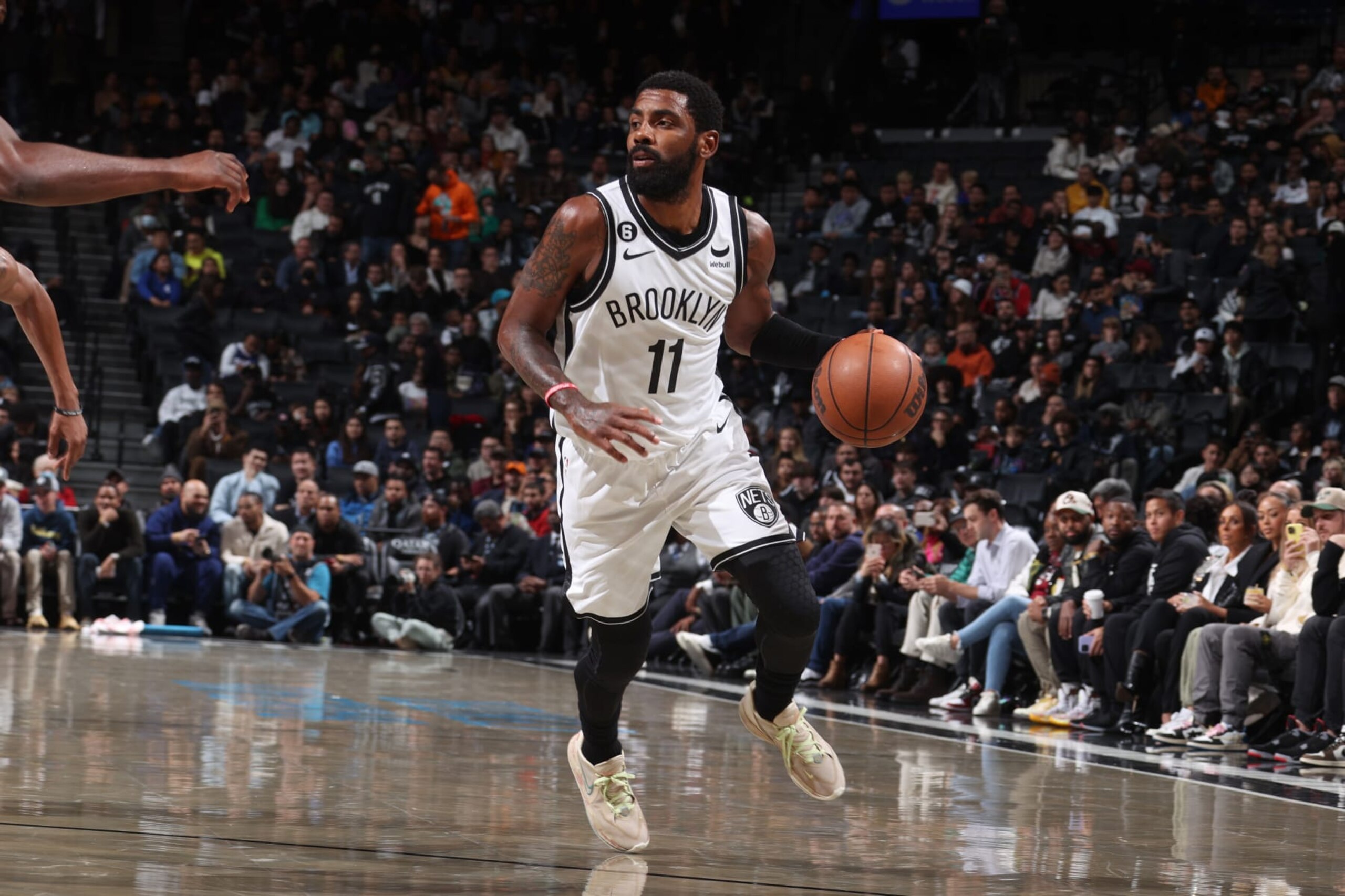 BROOKLYN, NY - OCTOBER 3: Kyrie Irving #11 of the Brooklyn Nets dribbles the ball against the Philadelphia 76ers during a preseason game on October 3, 2022 at Barclays Center in Brooklyn, New York. NOTE TO USER: User expressly acknowledges and agrees that, by downloading and or using this Photograph, user is consenting to the terms and conditions of the Getty Images License Agreement. Mandatory Copyright Notice: Copyright 2022 NBAE (Photo by Nathaniel S. Butler/NBAE via Getty Images)
