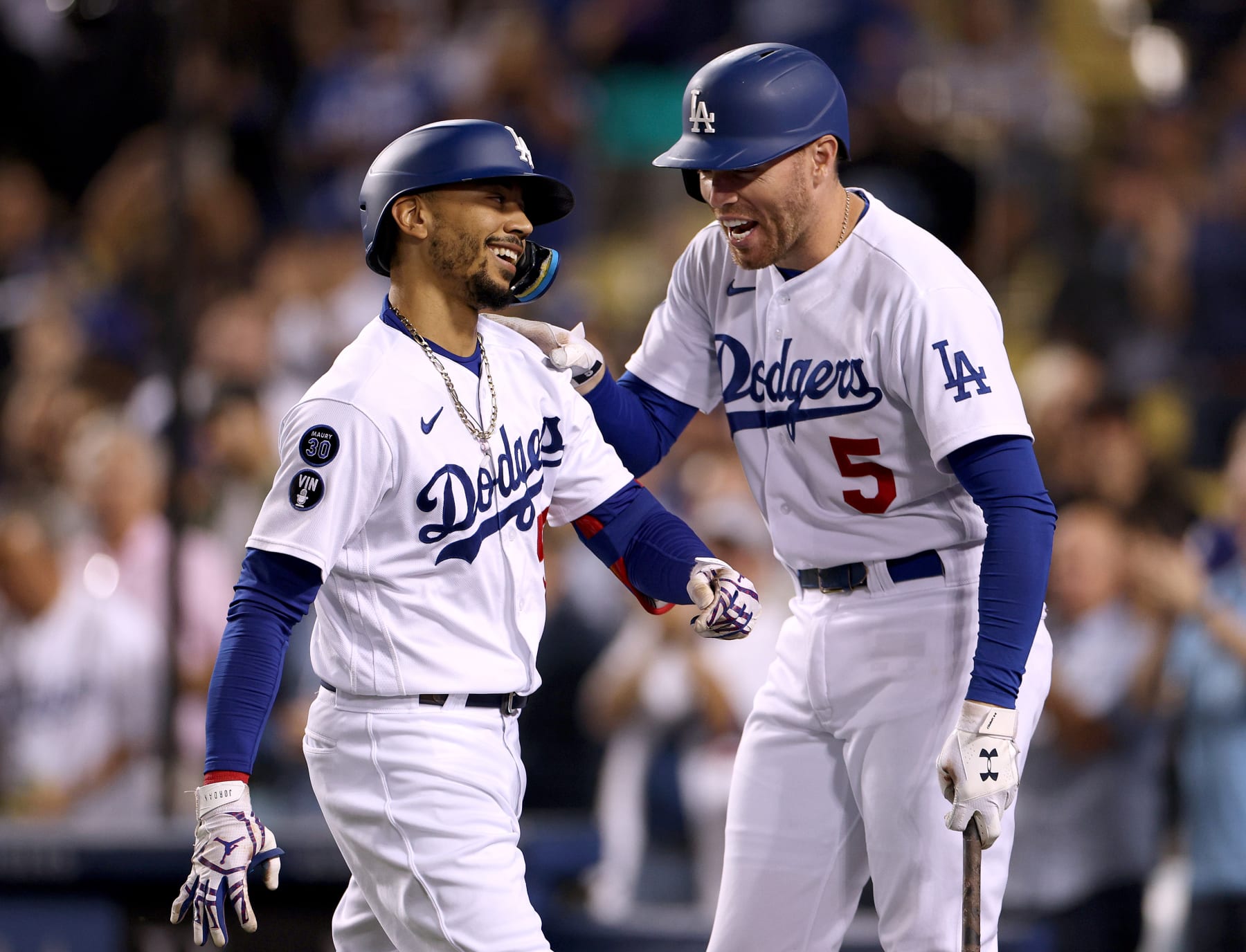 LOS ANGELES, CALIFORNIA - SEPTEMBER 21: Mookie Betts #50 of the Los Angeles Dodgers celebrates his solo homerun with Freddie Freeman #5, to trail the Arizona Diamondbacks 5-1, during the fourth inning at Dodger Stadium on September 21, 2022 in Los Angeles, California. (Photo by Harry How/Getty Images)