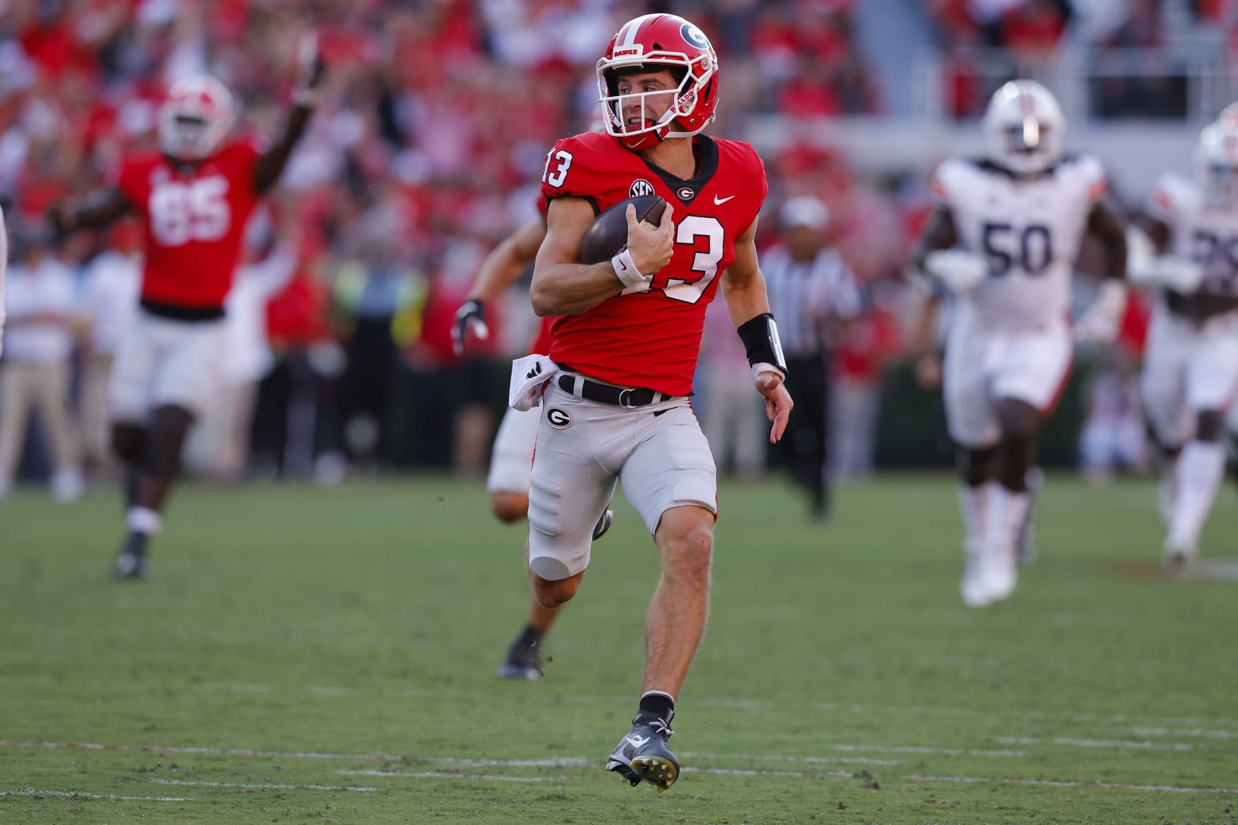 ATHENS, GA - OCTOBER 08: Stetson Bennett #13 of the Georgia Bulldogs rushes in for a touchdown in the second half against the Auburn Tigers at Sanford Stadium on October 8, 2022 in Athens, Georgia. (Photo by Todd Kirkland/Getty Images)