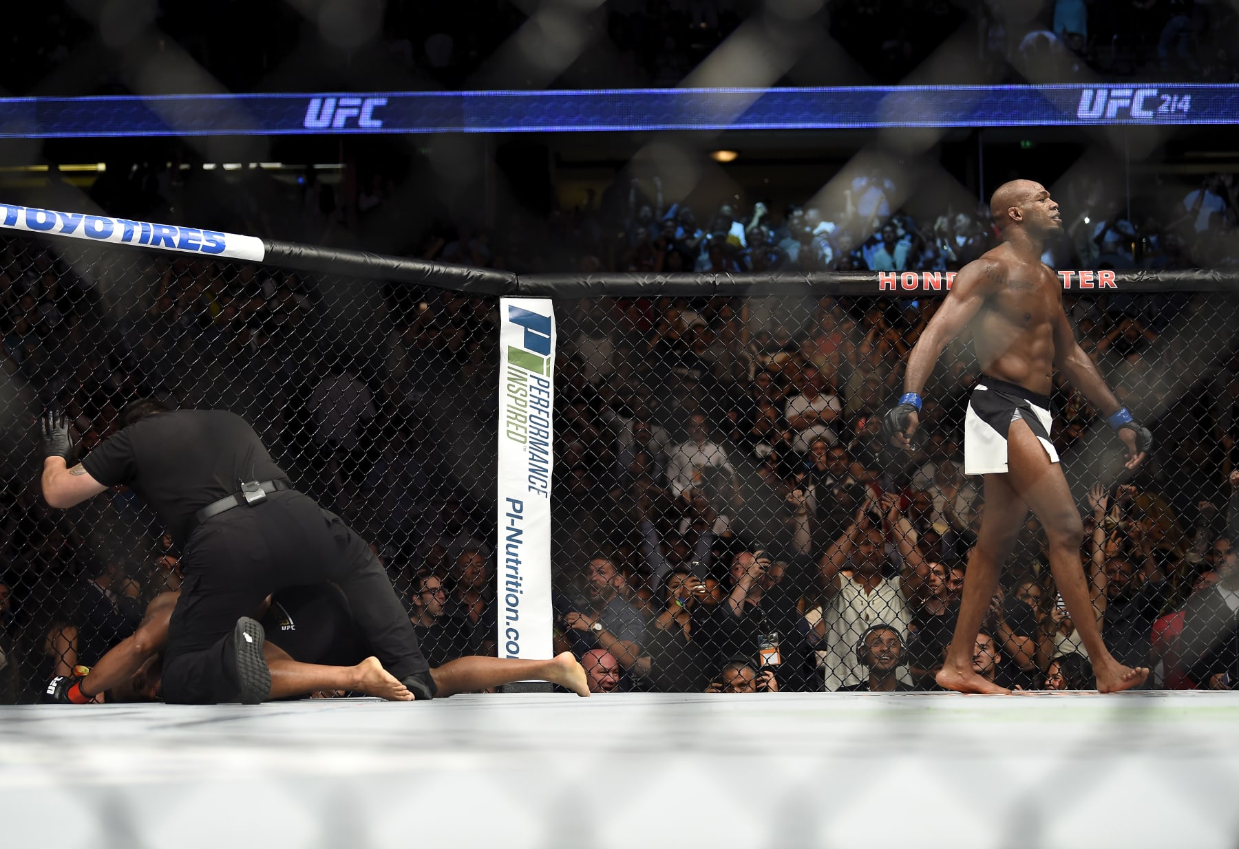 ANAHEIM, CA - JULY 29:  (R-L) Jon Jones celebrates after defeating Daniel Cormier in their UFC light heavyweight championship bout during the UFC 214 event inside the Honda Center on July 29, 2017 in Anaheim, California. (Photo by Jeff Bottari/Zuffa LLC/Zuffa LLC via Getty Images)