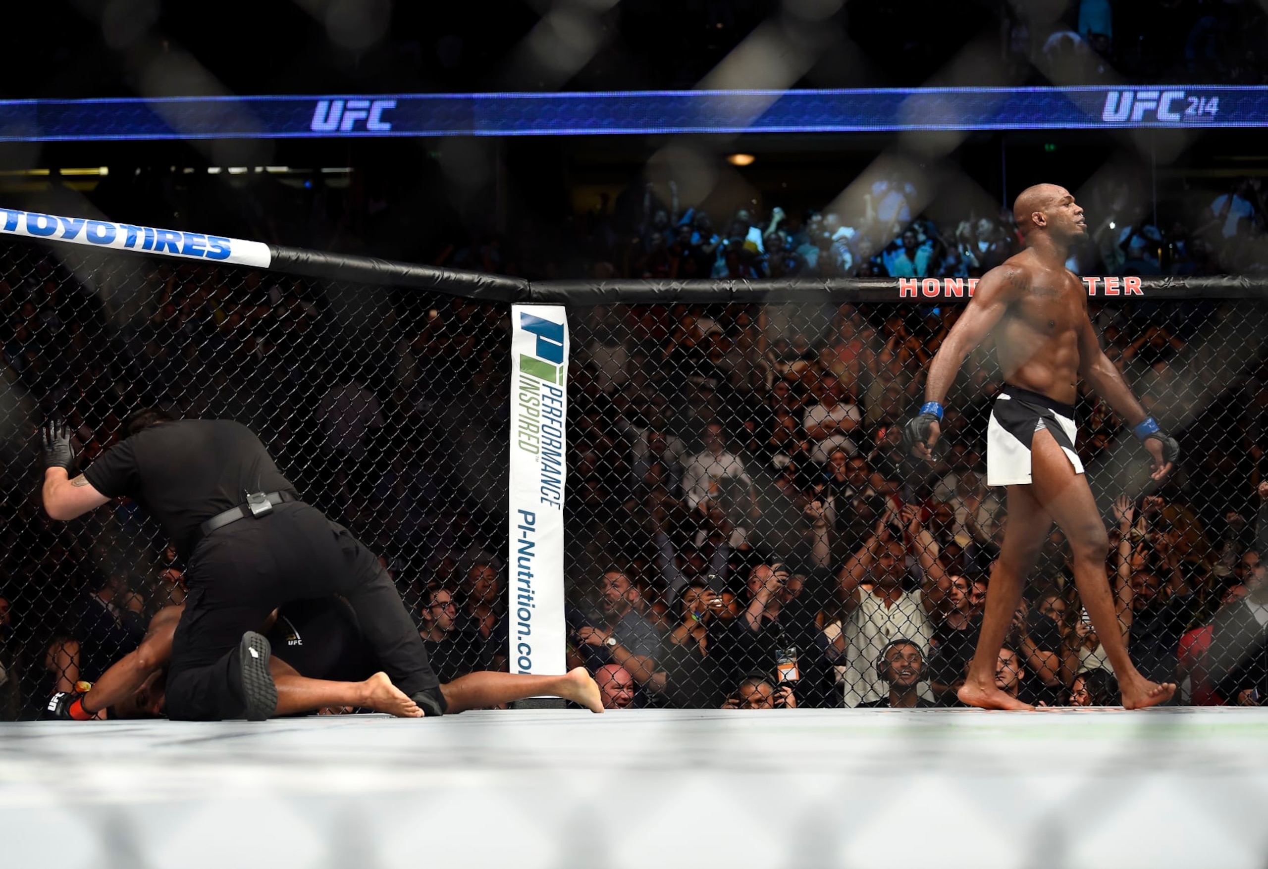 ANAHEIM, CA - JULY 29:  (R-L) Jon Jones celebrates after defeating Daniel Cormier in their UFC light heavyweight championship bout during the UFC 214 event inside the Honda Center on July 29, 2017 in Anaheim, California. (Photo by Jeff Bottari/Zuffa LLC/Zuffa LLC via Getty Images)