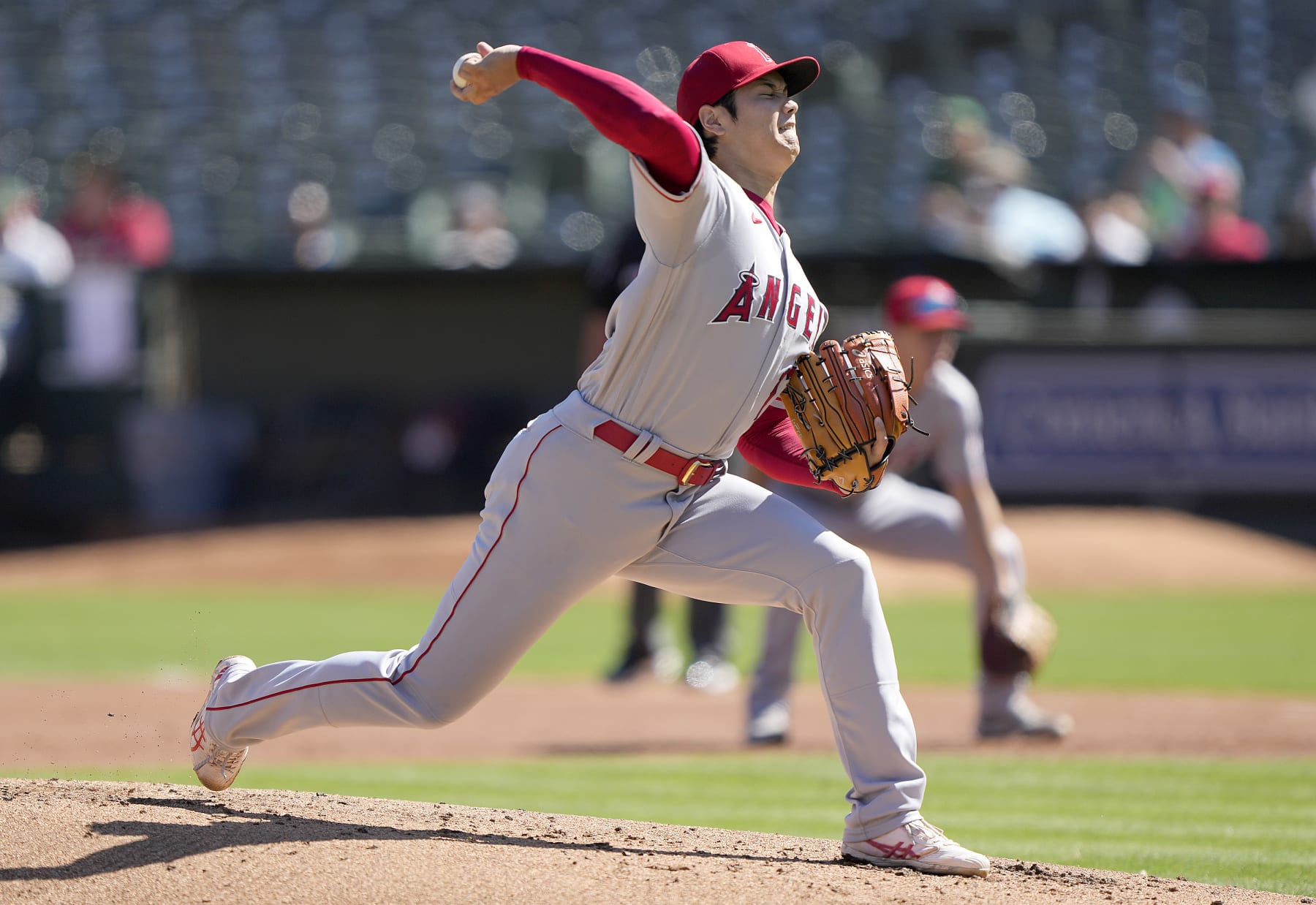OAKLAND, CALIFORNIA - OCTOBER 05: Shohei Ohtani #17 of the Los Angeles Angels pitches against the Oakland Athletics in the bottom of the first inning at RingCentral Coliseum on October 05, 2022 in Oakland, California. (Photo by Thearon W. Henderson/Getty Images)