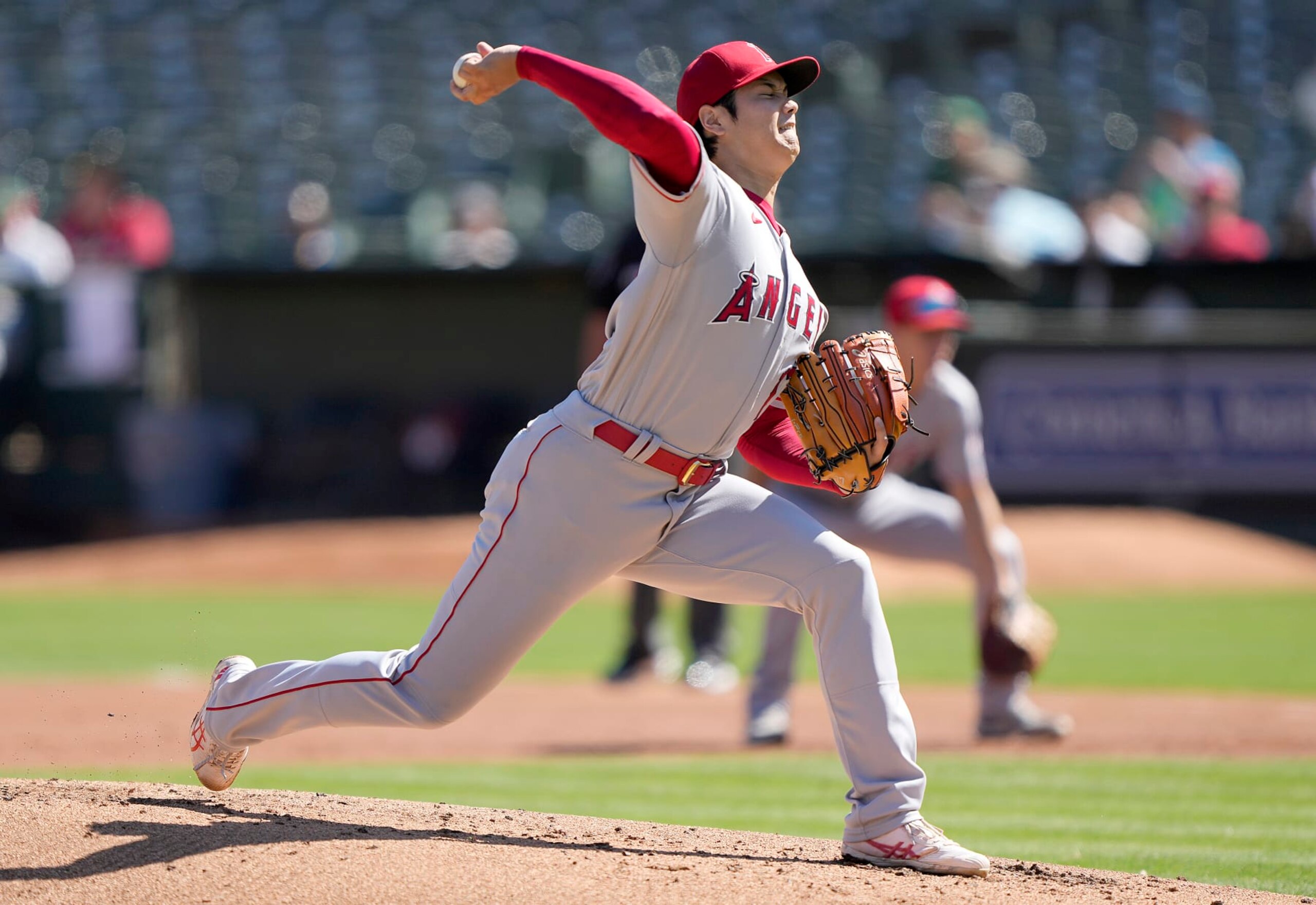 OAKLAND, CALIFORNIA - OCTOBER 05: Shohei Ohtani #17 of the Los Angeles Angels pitches against the Oakland Athletics in the bottom of the first inning at RingCentral Coliseum on October 05, 2022 in Oakland, California. (Photo by Thearon W. Henderson/Getty Images)